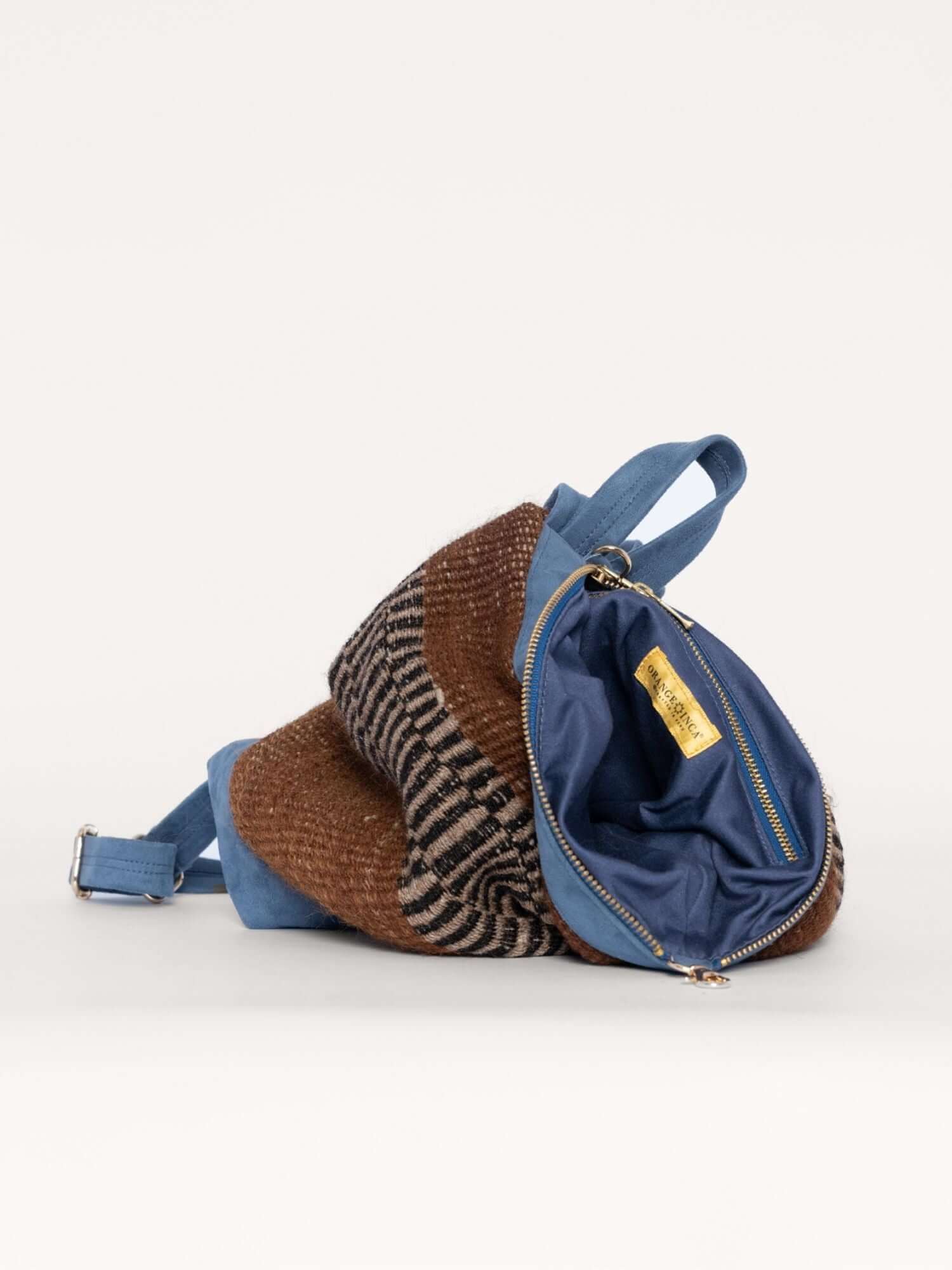 Back of luxury wool and suede backpack – vegetable-tanned suede straps and structured back panel