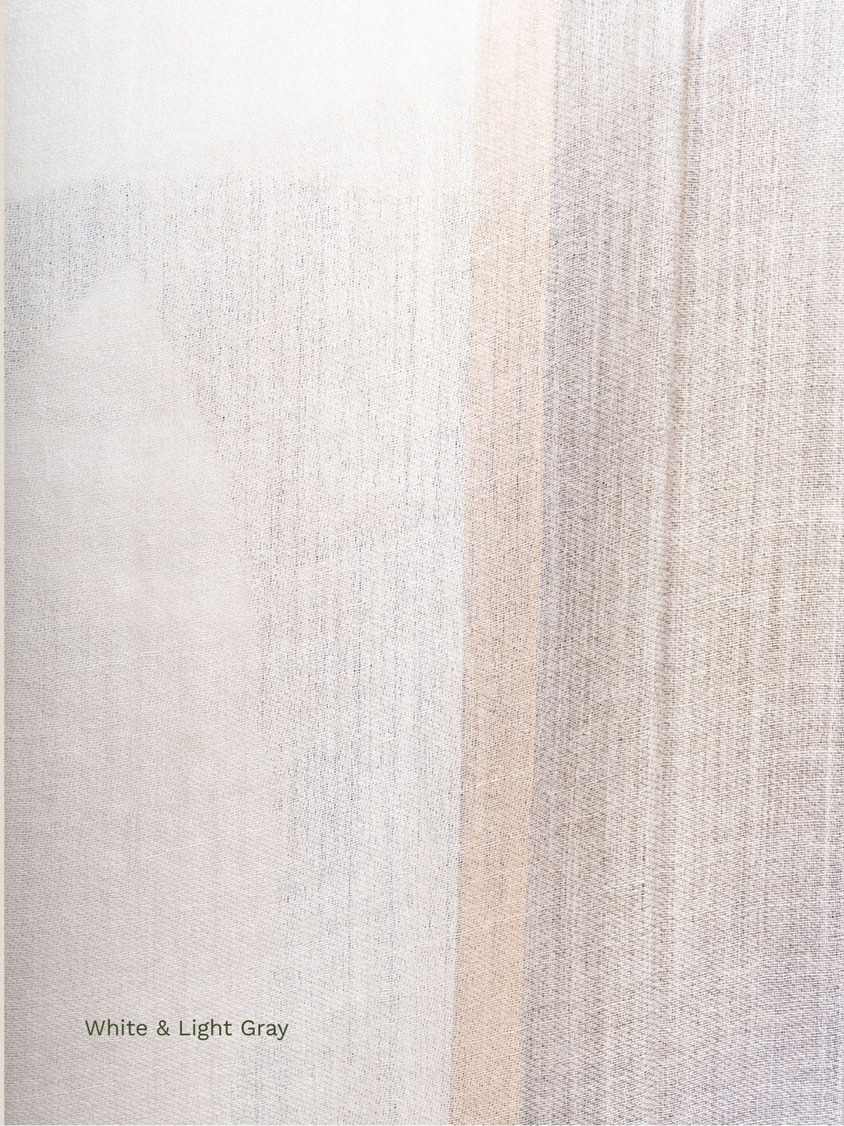 Close-up of the white and light grey stripes on a silk baby alpaca blend shawl, fine lightweight weave