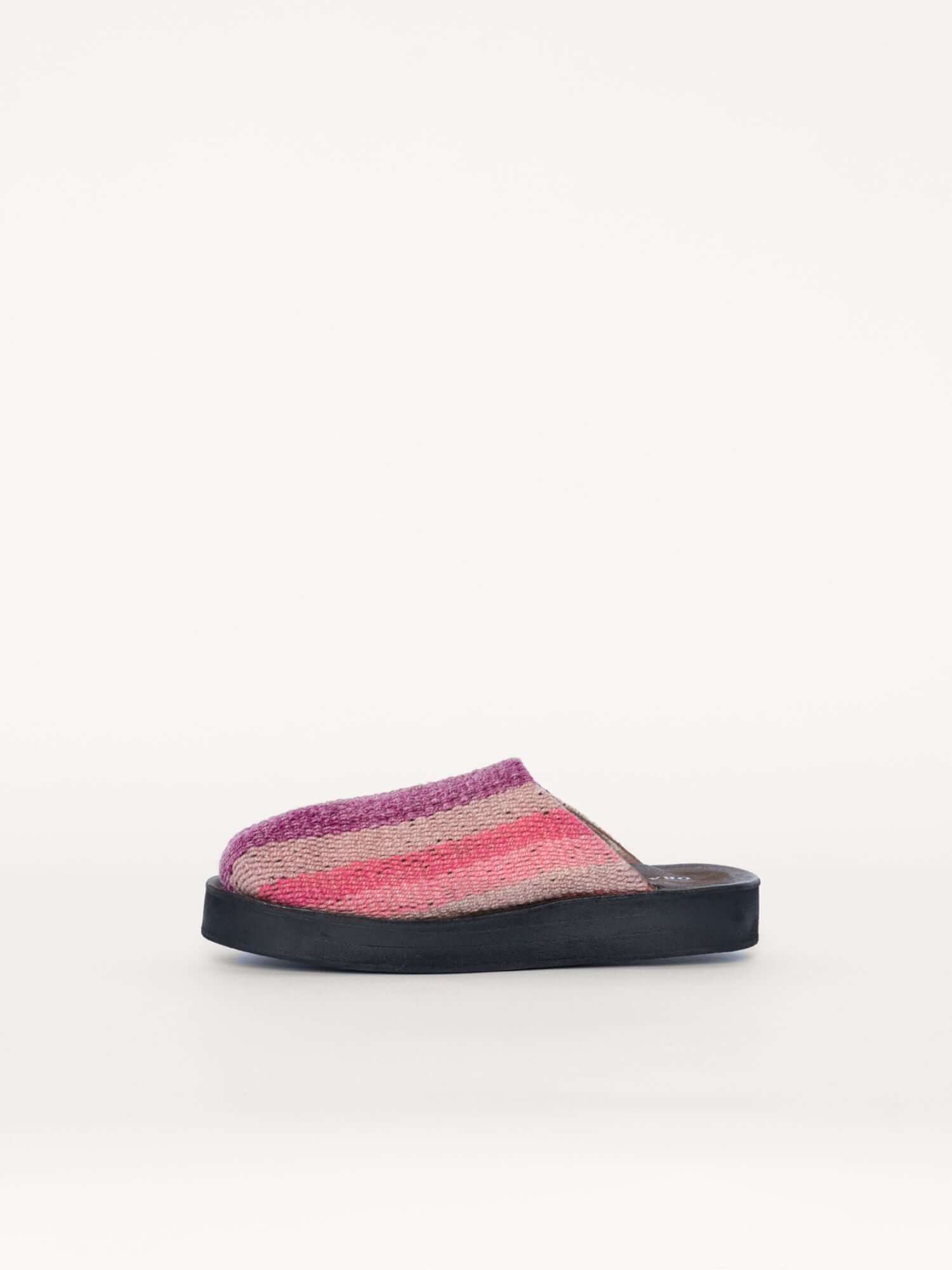 Pink wool and leather clogs for women and men, left side view.