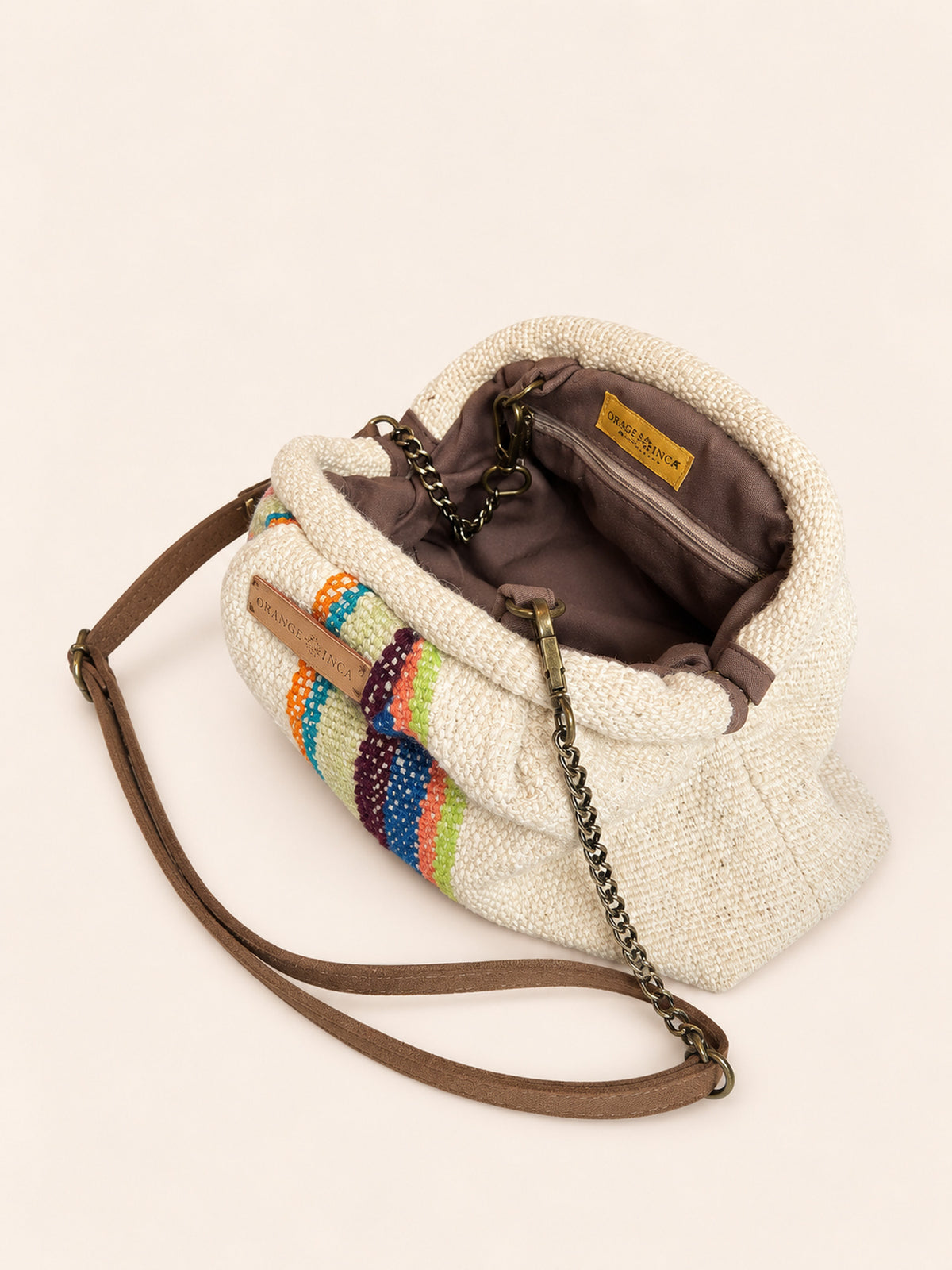 Inside the Alba kiss lock clutch in natural with bright stripes – cotton drill lining, zip pocket and detachable faux suede and chain strap | Orange Inca