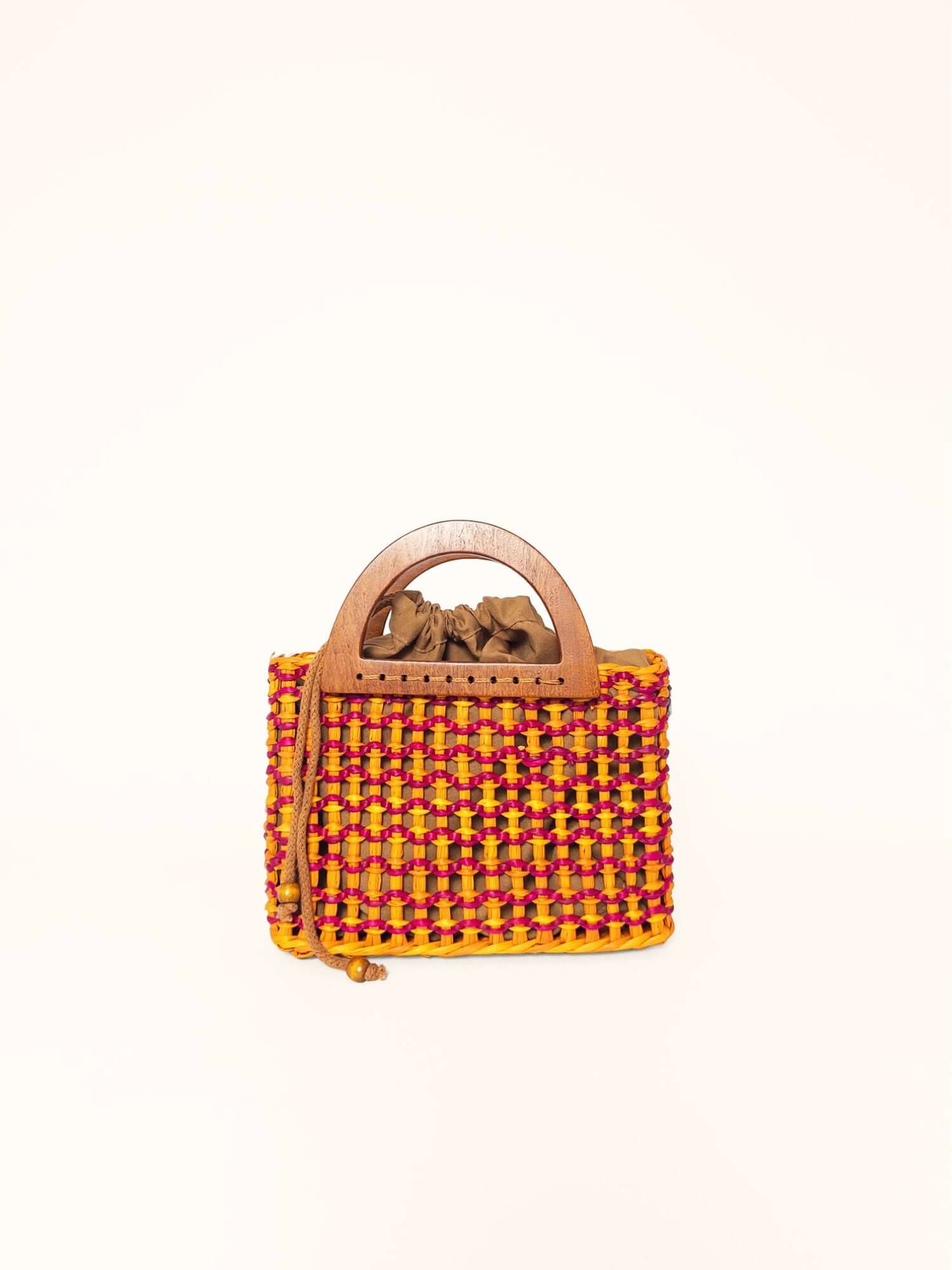 Brigitte woven handbag fuchsia and yellow angle view – cotton-lined, drawstring closure | Orange Inca