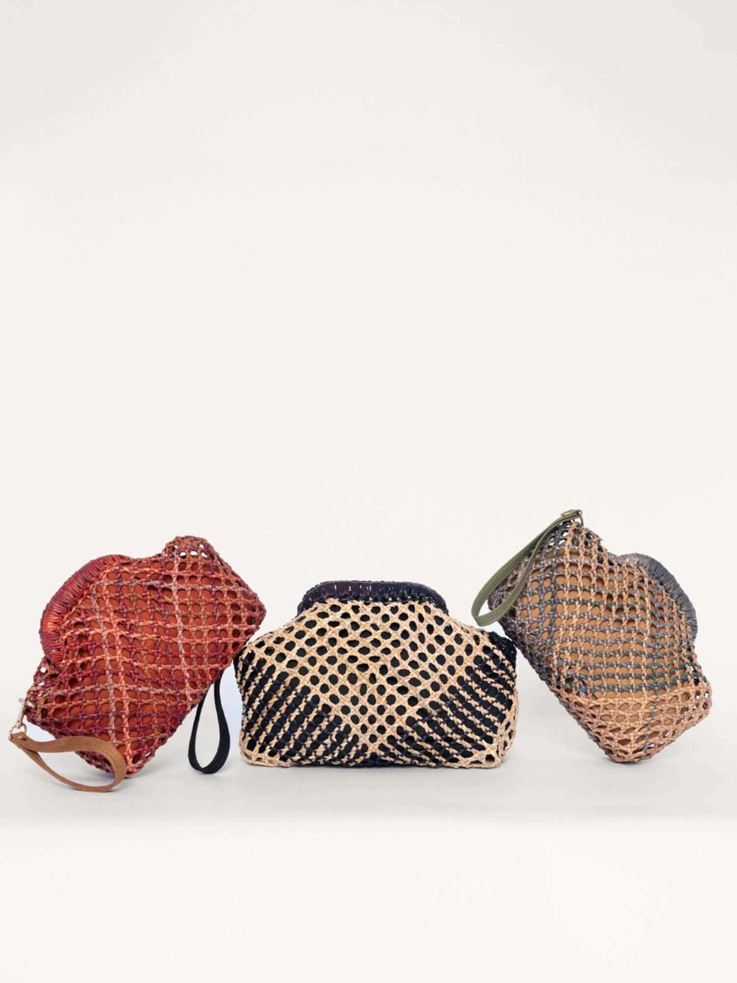 Group shot of artisan kiss lock bags – handcrafted natural fibre clutches available worldwide