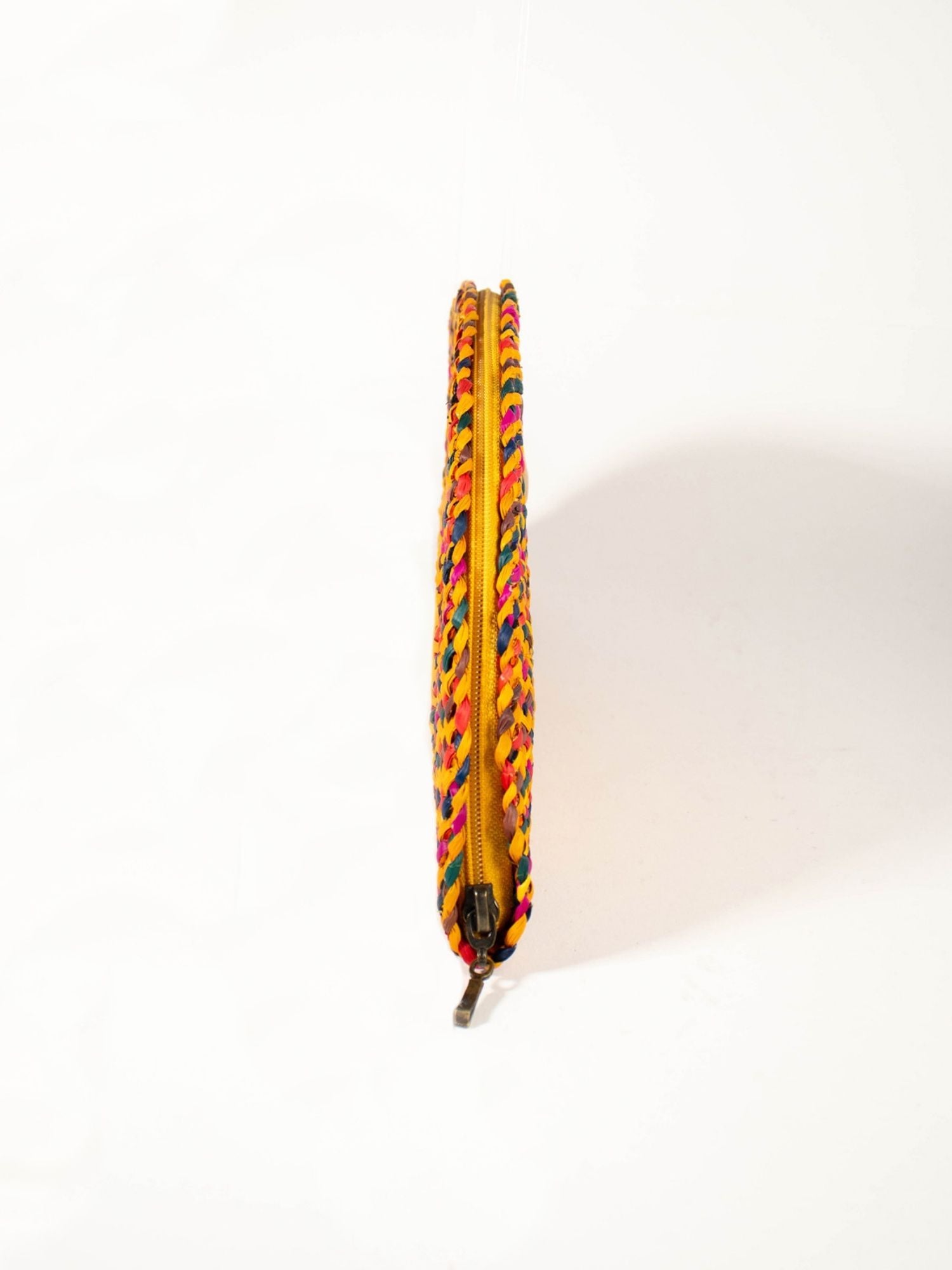 Detail of handwoven natural reed weave, Flamenco Clutch – Yellow Carnival | Orange Inca