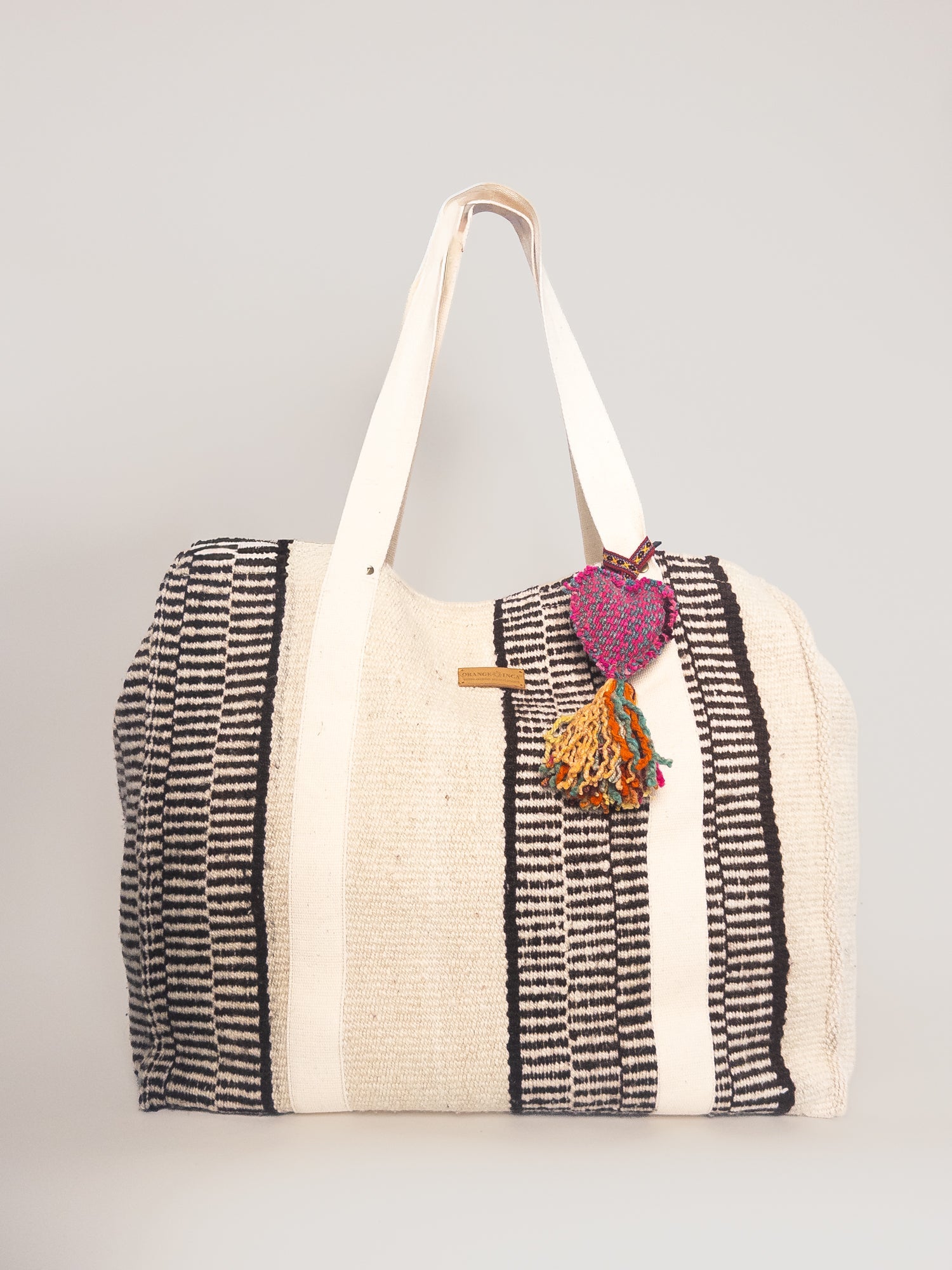 Manta Weekender – Earthy Tones and Ivory, open top showing interior | Orange Inca