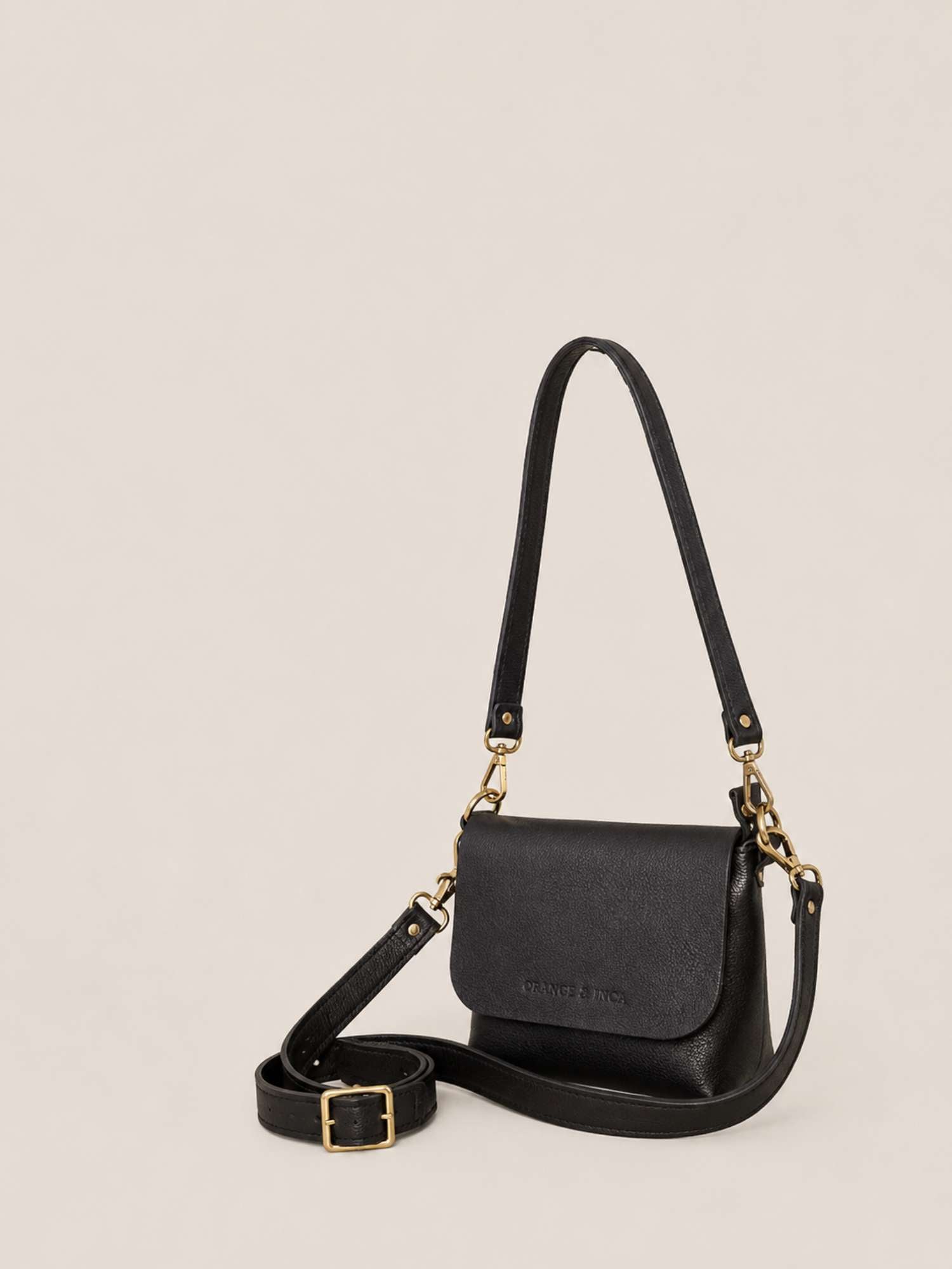 The Olivia Black leather crossbody — both straps shown (shoulder + crossbody) | Orange Inca