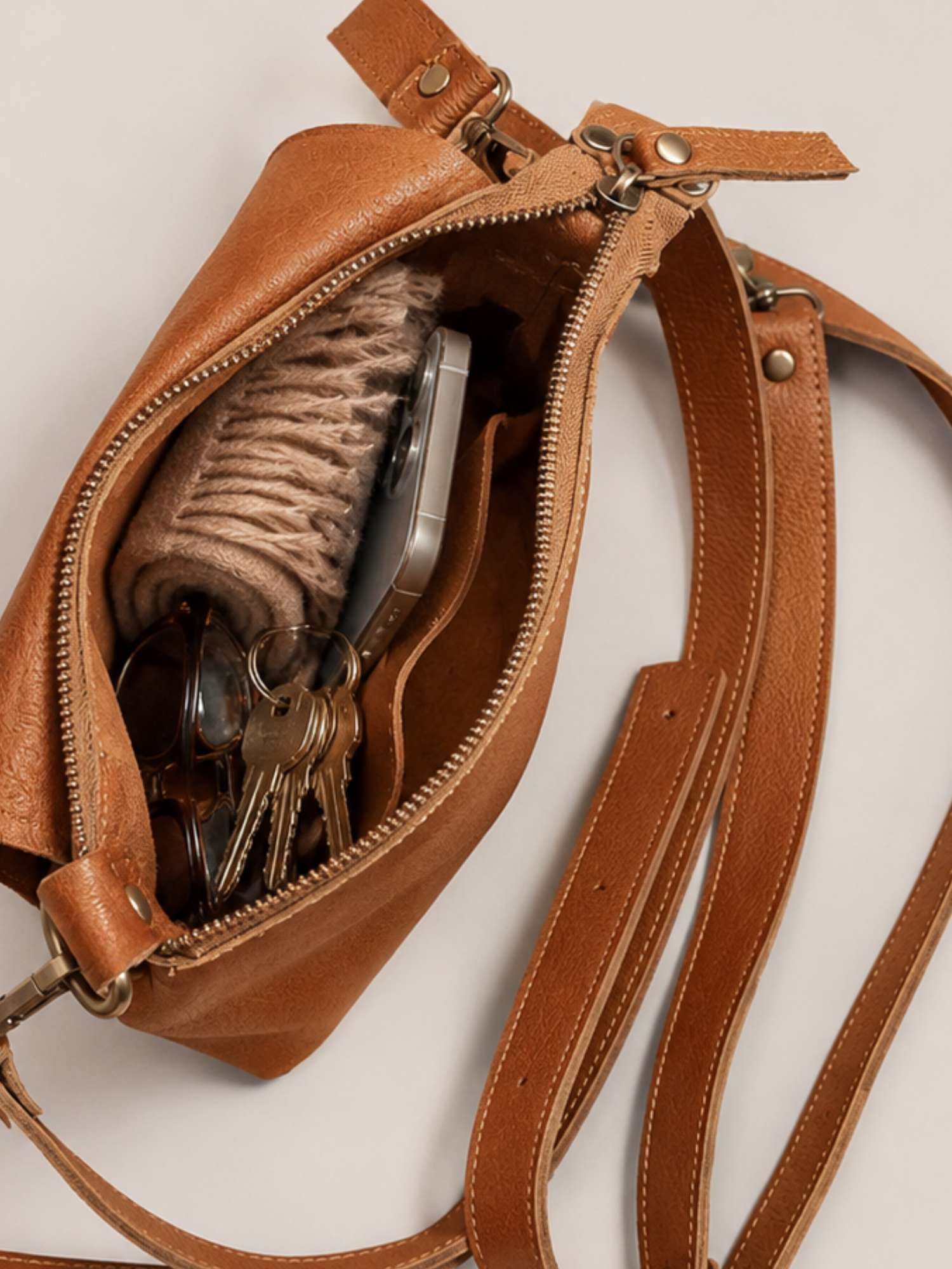 Cognac Olivia interior — unlined leather inside and out, zip closure | Orange Inca