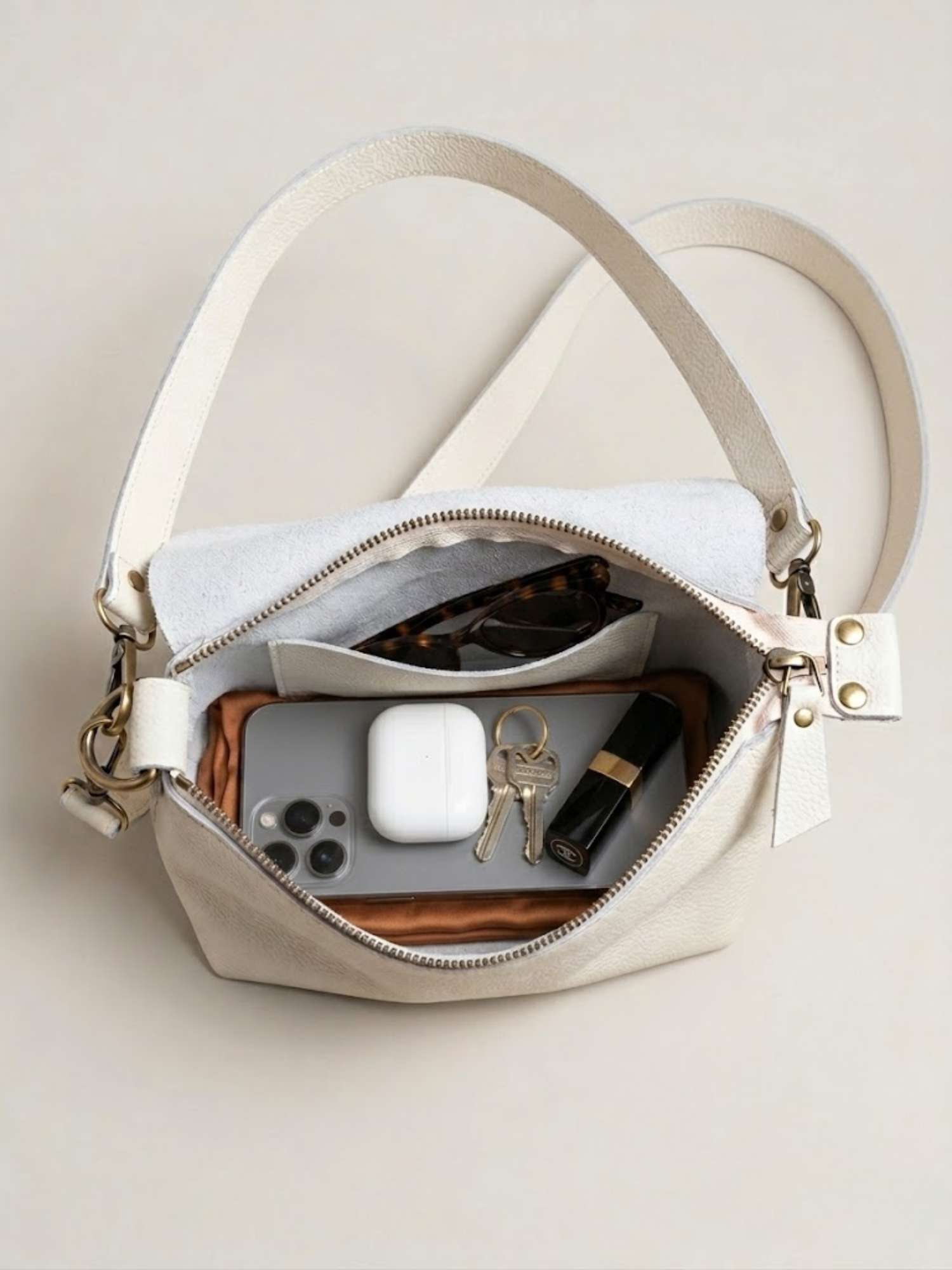 Ivory Olivia interior — unlined leather inside and out, zip closure | Orange Inca