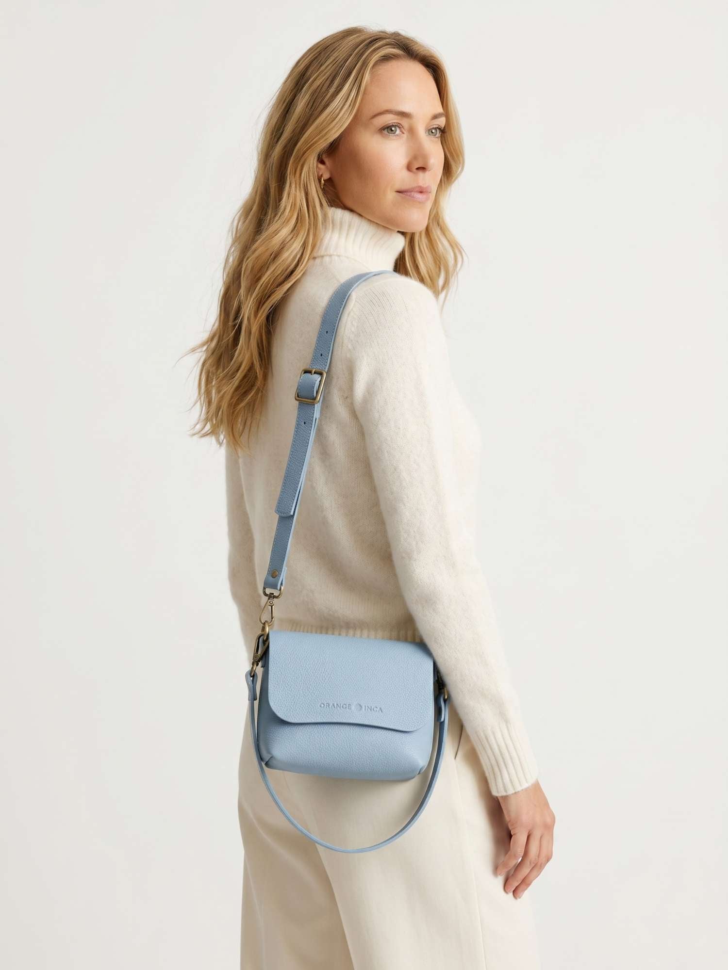 The Olivia Powder Blue leather crossbody — back view with both straps attached, full-grain leather | Orange Inca