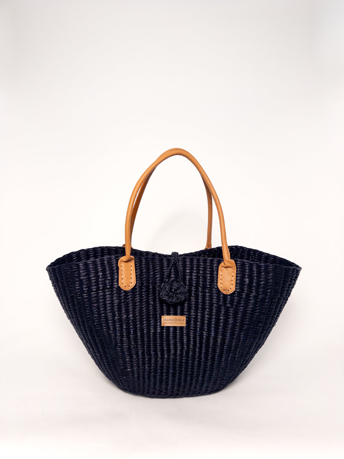 Playa Tote - Black handwoven junco tote bag with faux leather straps and natural dyes, showcasing structured construction.