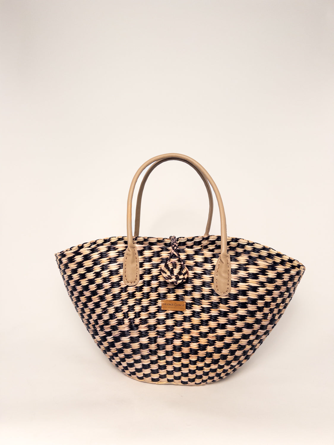 Playa Tote - Checkered Black and Natural, handwoven junco tote bag with faux leather straps and cotton drawstring.