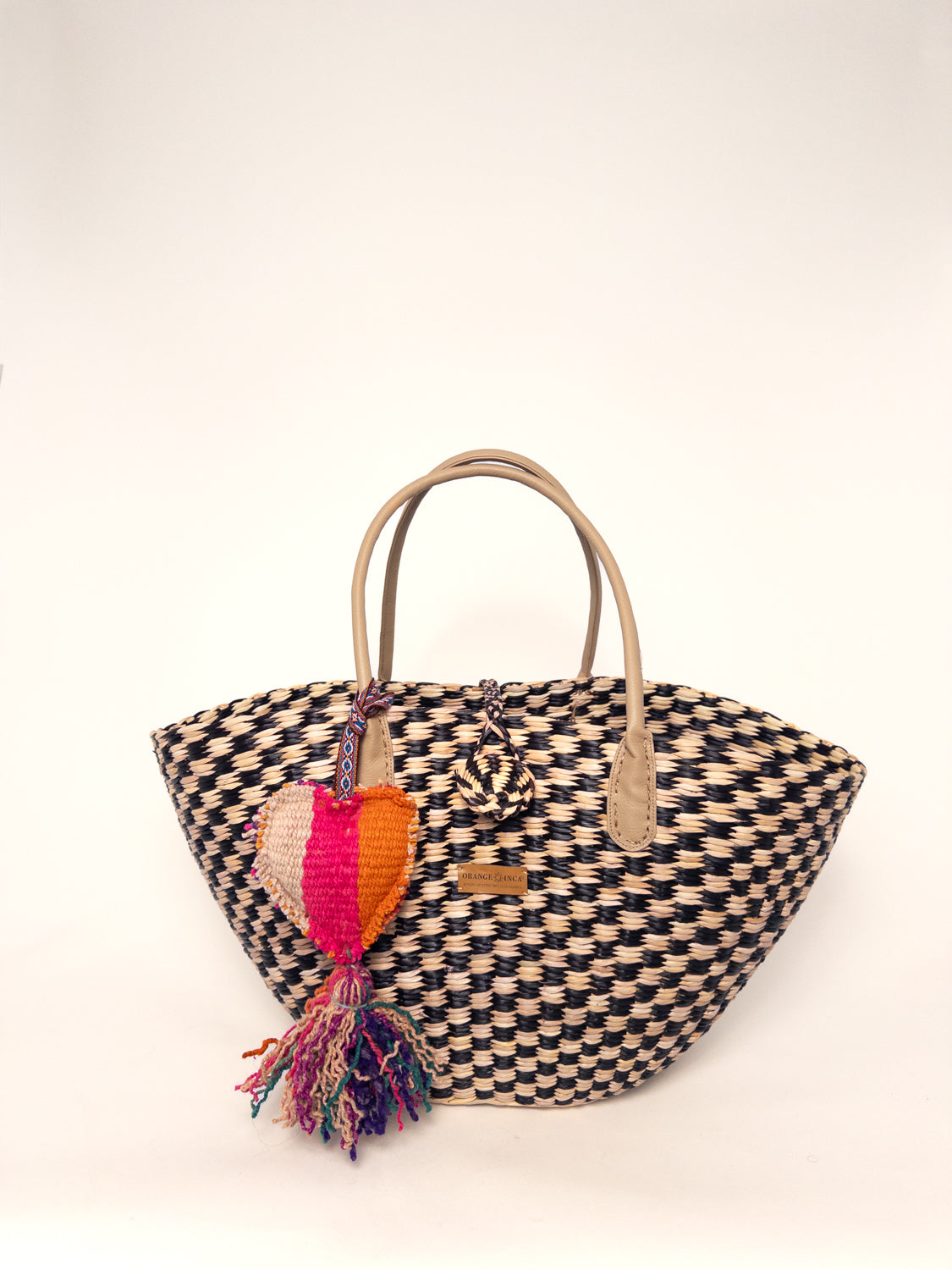 Playa Tote - Checkered Black and Natural handwoven junco tote bag with faux leather straps and colorful tassel.
