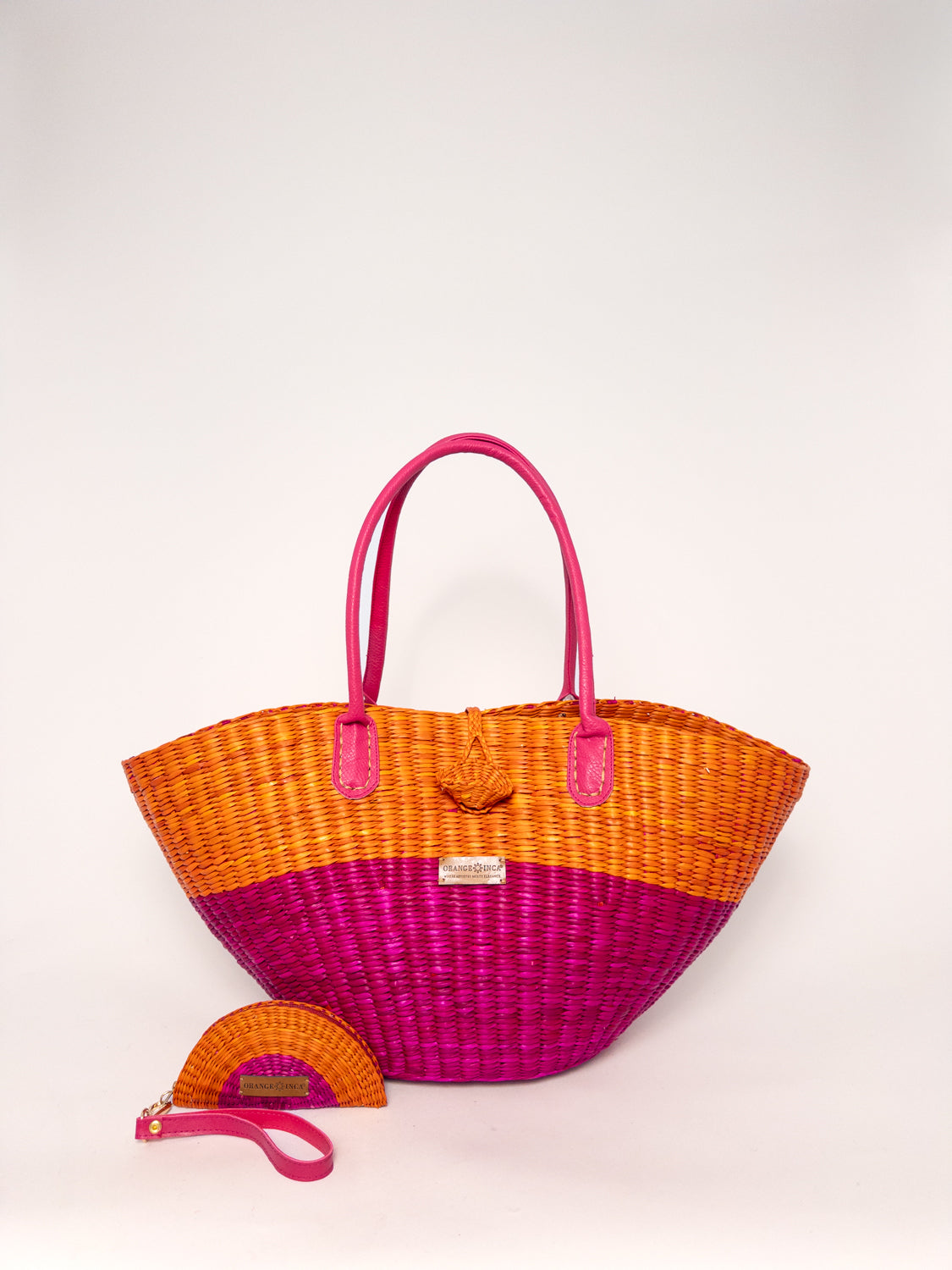 Playa Tote - Half Fuchsia Half Orange handwoven junco tote bag with faux leather straps and coin purse.