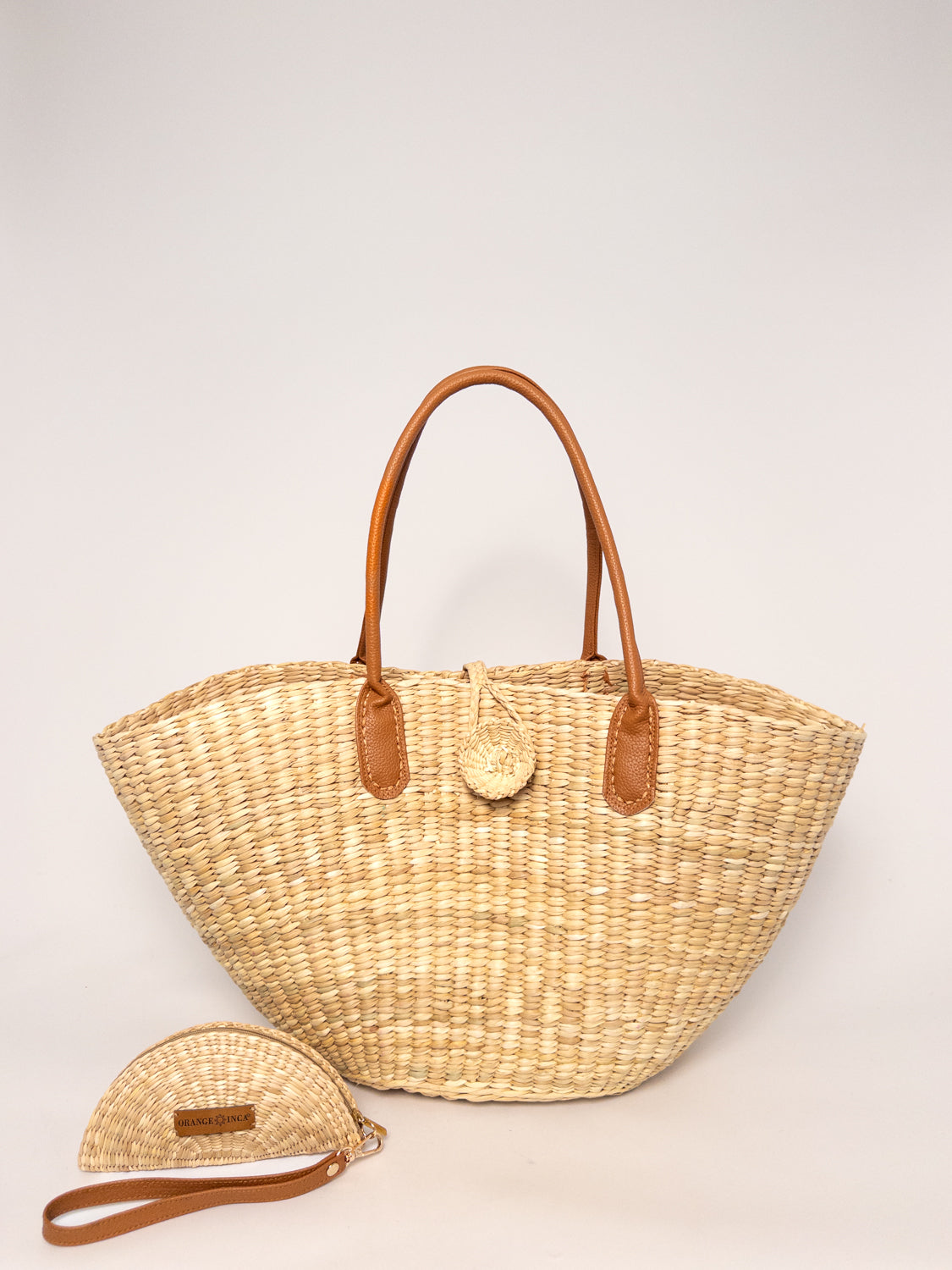 Playa Tote - Natural, handwoven junco tote bag, natural dyes, faux leather straps, sculptural design.