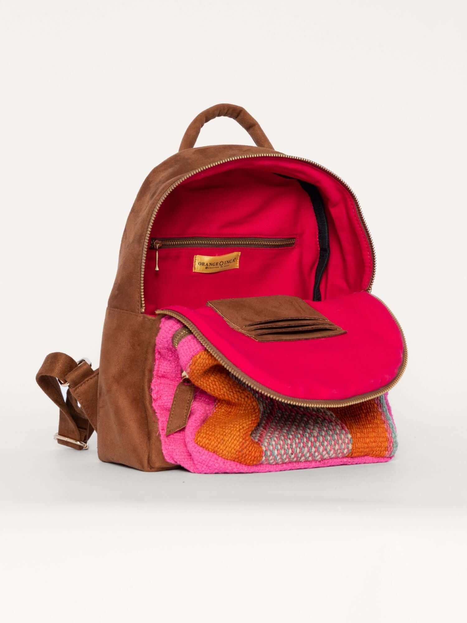 Interior of Tierra Backpack with soft lining and secure zip pocket – functional artisan backpack with wool details