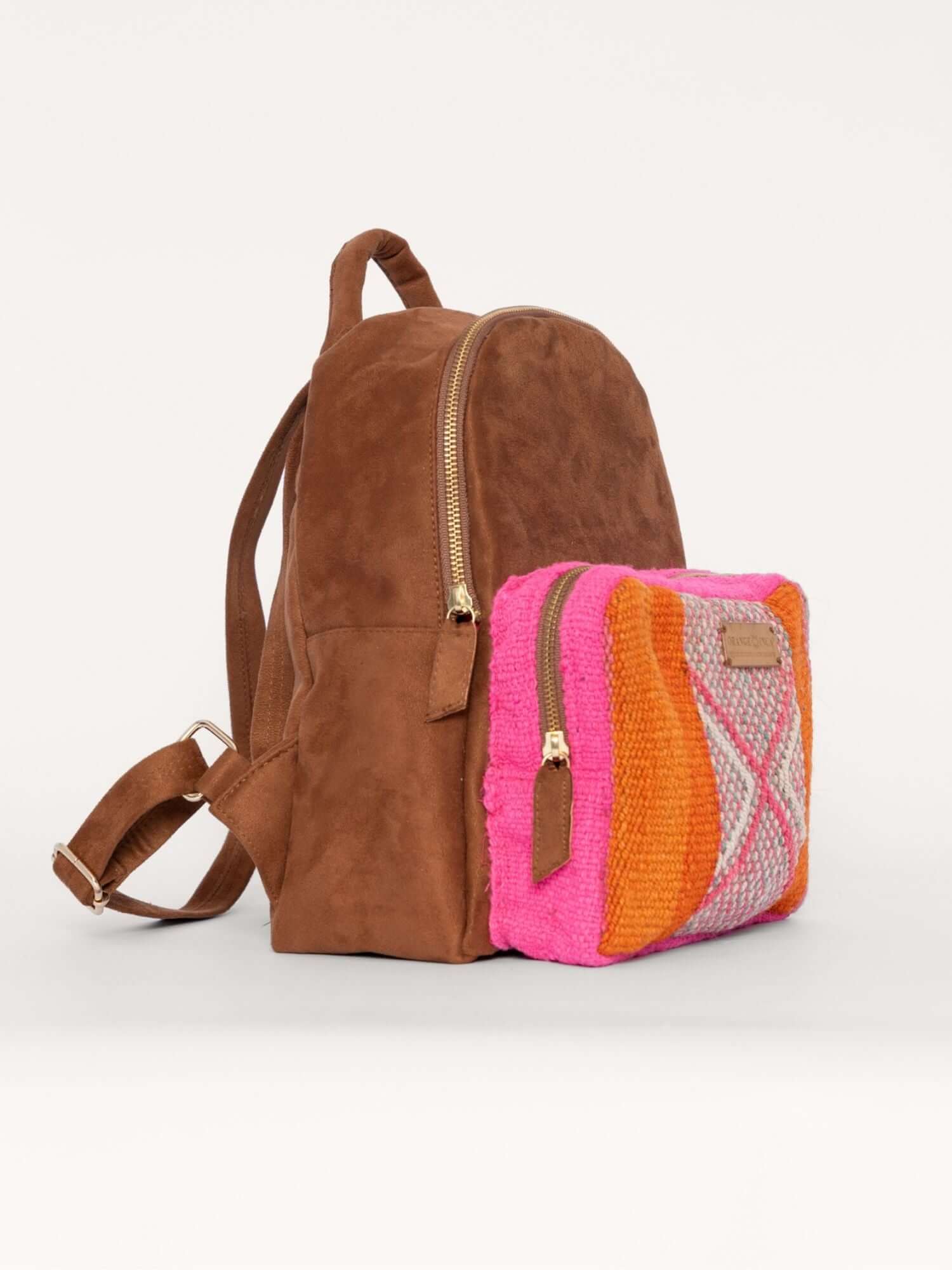 Side view of artisan wool and suede backpack – soft yet structured, with vibrant Andean textile detailing