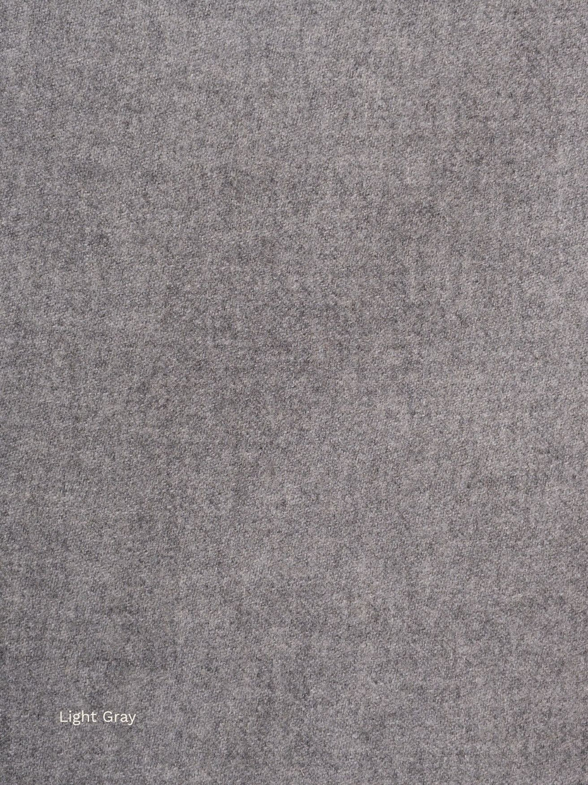 Light grey undyed baby alpaca scarf, close-up of the soft natural grey fabric