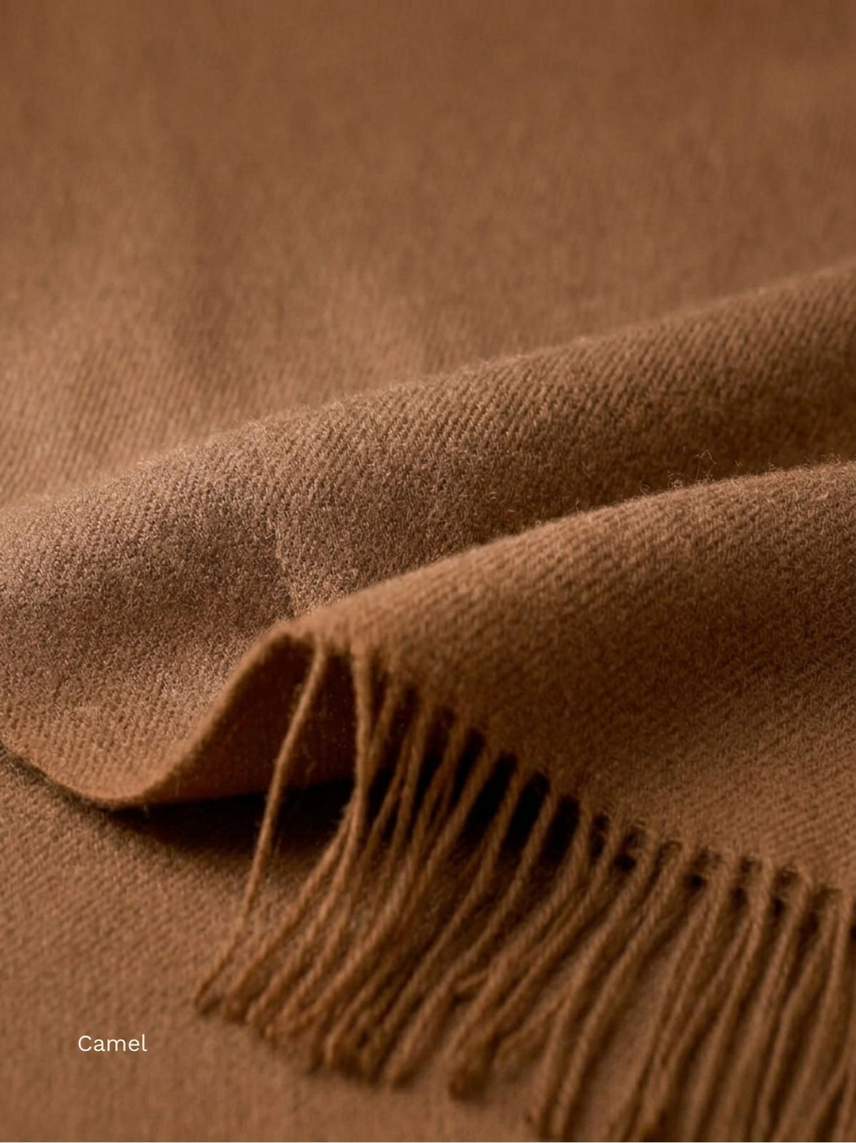 Camel undyed baby alpaca shawl, close-up of the soft woven fabric and twisted fringe