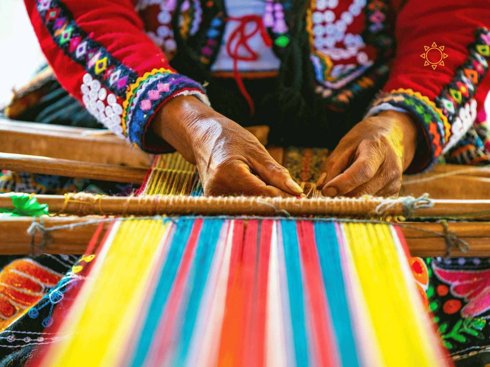 Peruvian Woman Artisan Weaving a Colourful Frazada - a versatile throw blanket in bohemian style