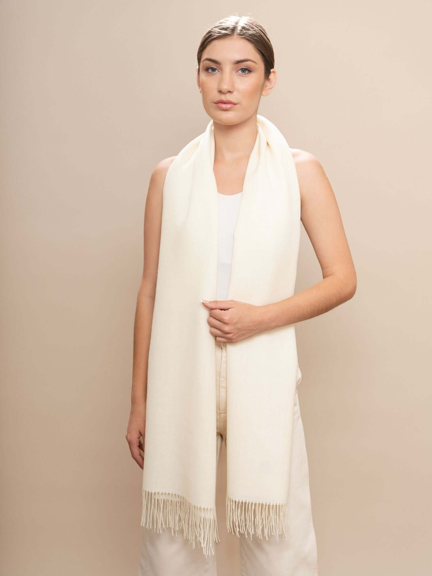 Ivory alpaca wool shawl draped to show full length and drape.