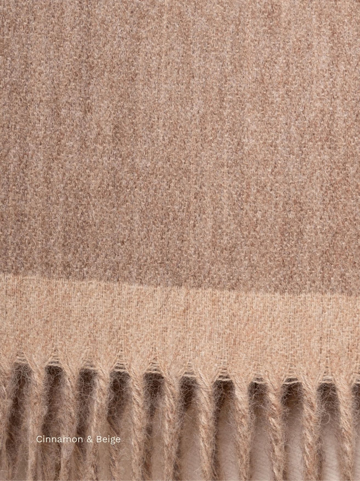 Cinnamon and beige double face baby alpaca scarf, close-up of the two-tone fabric and fringe