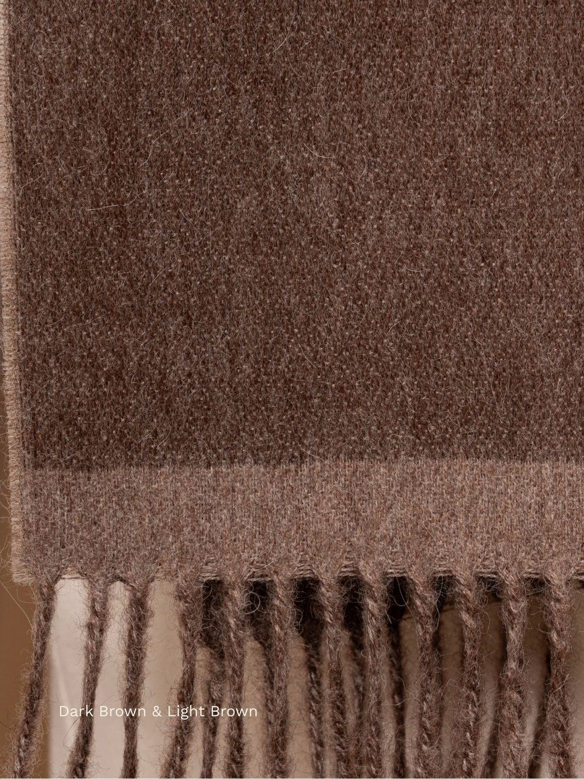Dark brown and light brown double face baby alpaca scarf, close-up of the reversible fabric and fringe