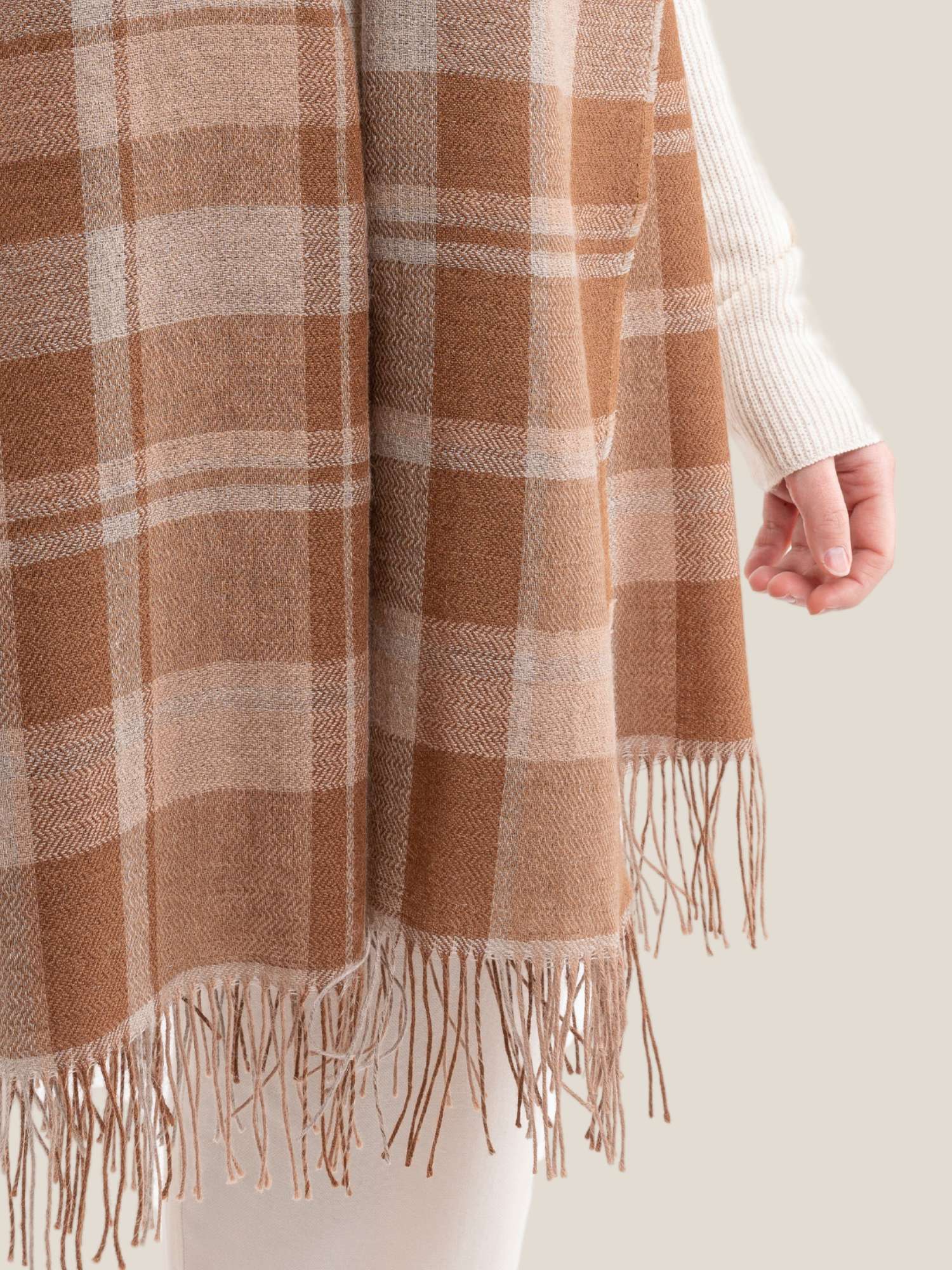 Close-up of camel and beige plaid baby alpaca shawl – herringbone weave texture and fringe, handmade in Peru | Orange Inca