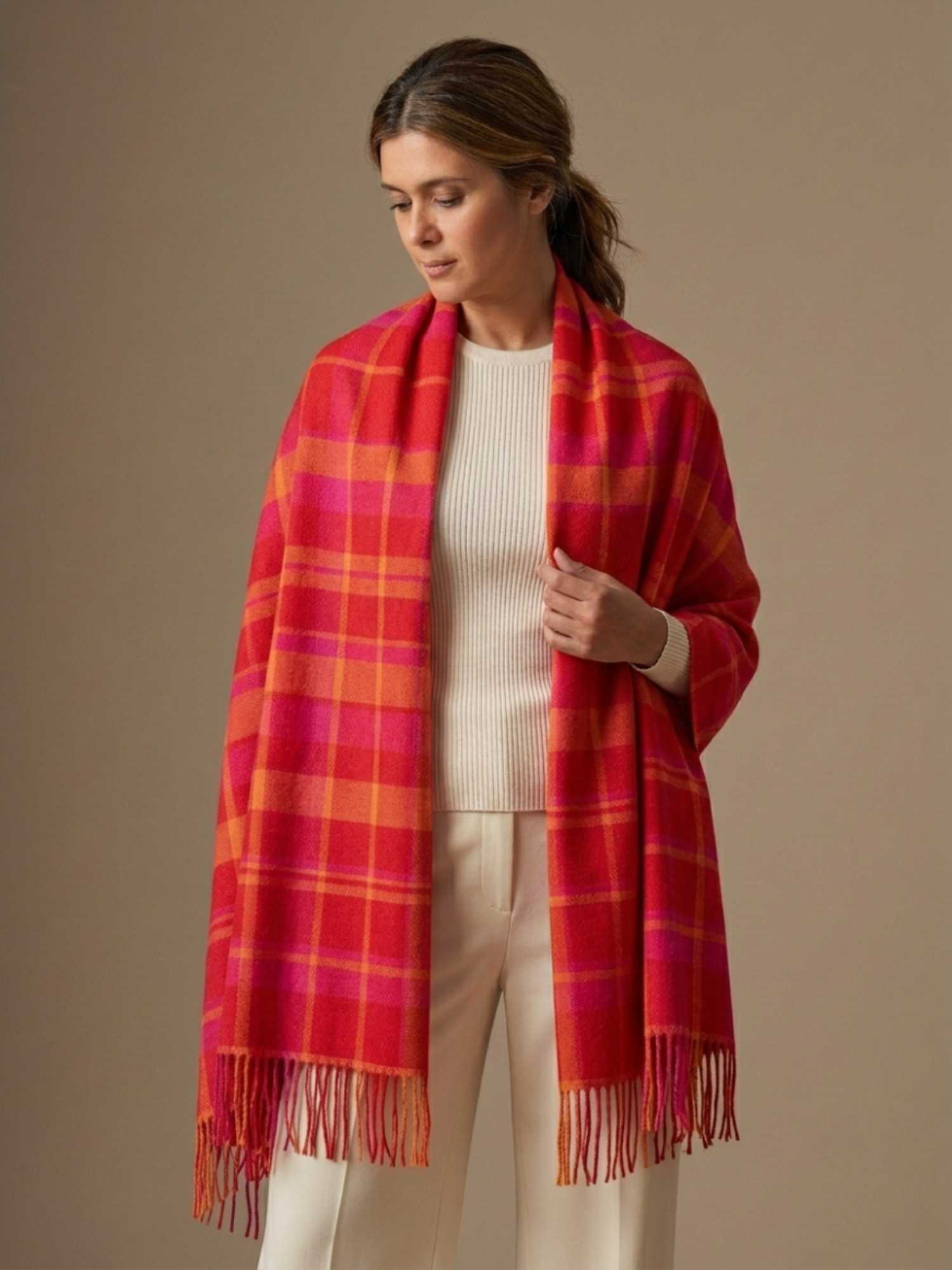 Fuchsia, red and yellow plaid baby alpaca shawl worn as wrap – limited edition, handmade in Peru | Orange Inca