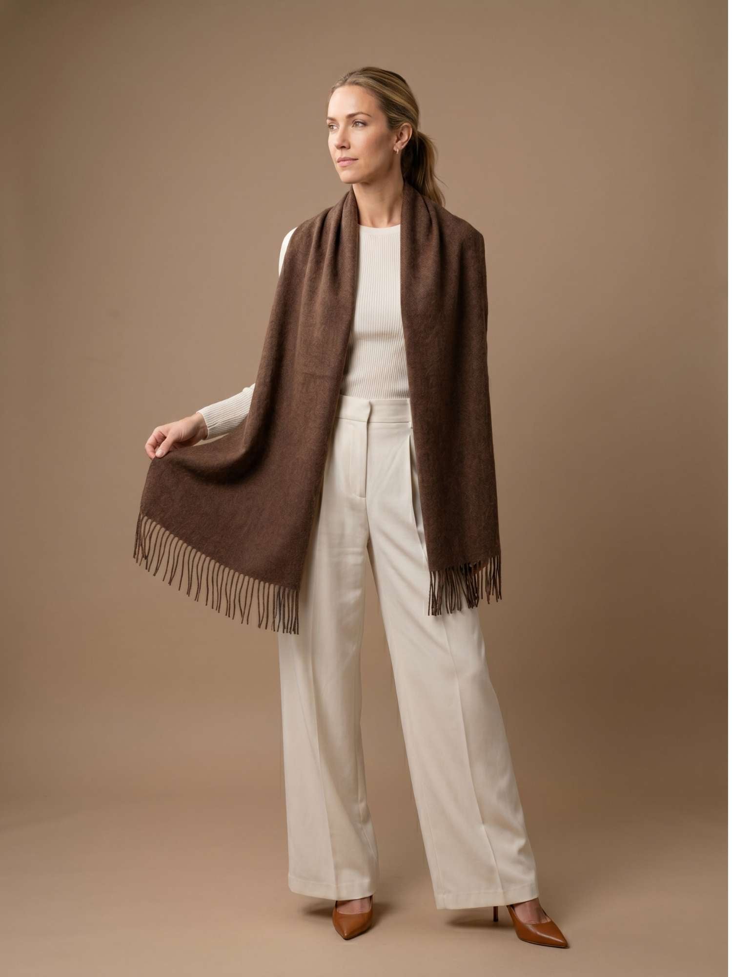 Brown baby alpaca scarf worn over the shoulders — undyed natural fibre tone, handmade in Peru | Orange Inca