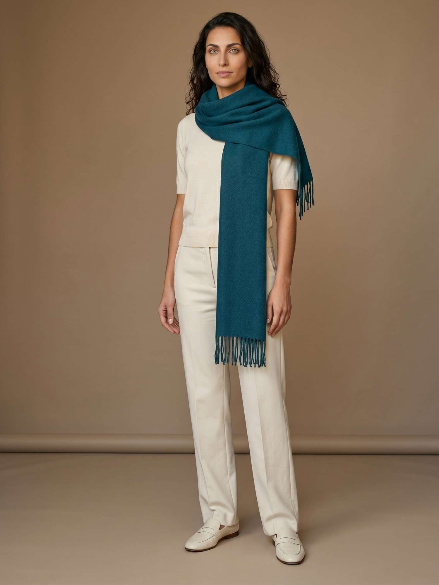 Jade baby alpaca scarf worn over the shoulders — naturally dyed, softer than cashmere, handmade in Peru | Orange Inca