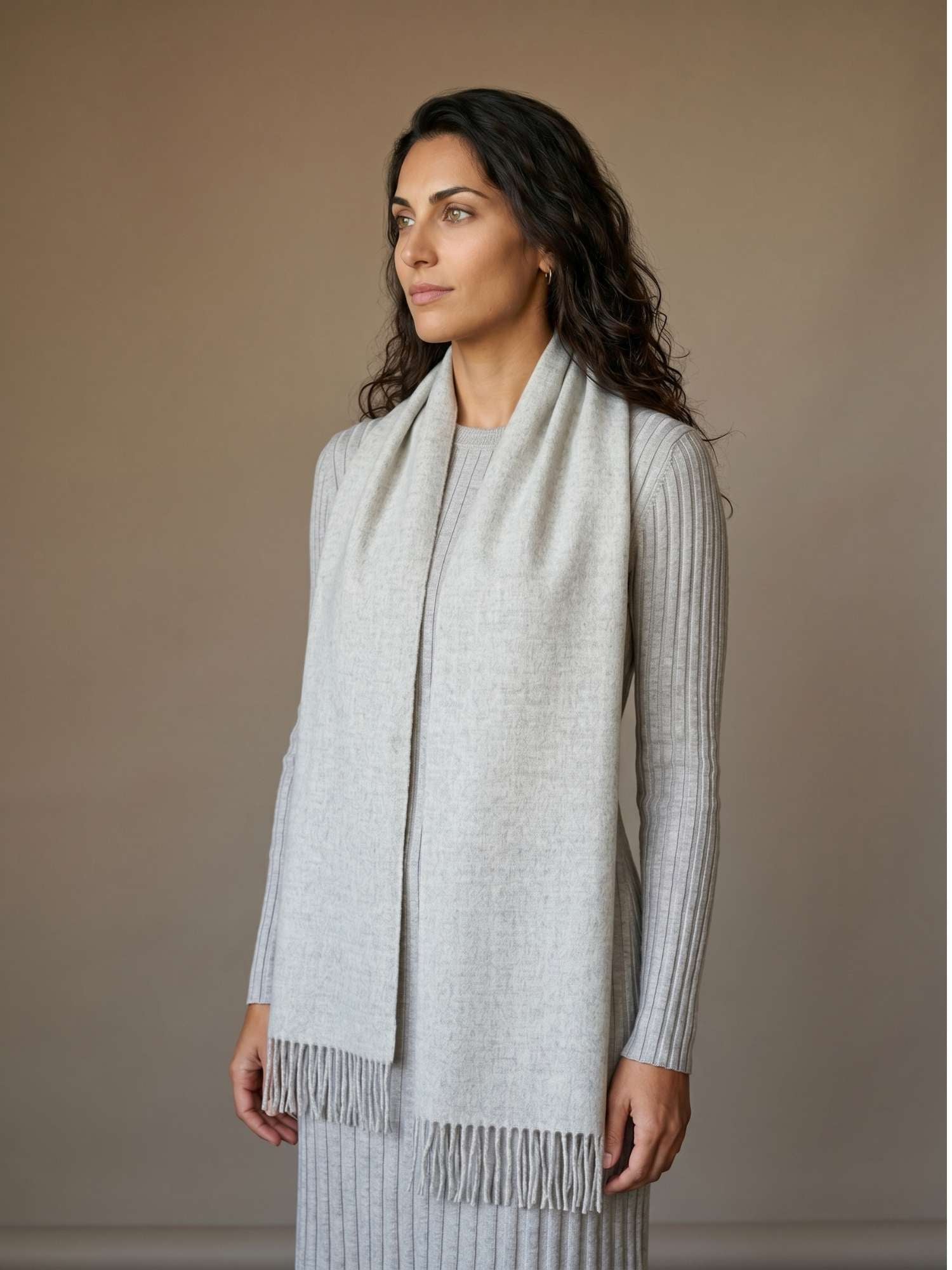 Light grey baby alpaca scarf worn over the shoulders — undyed natural fibre tone, handmade in Peru | Orange Inca