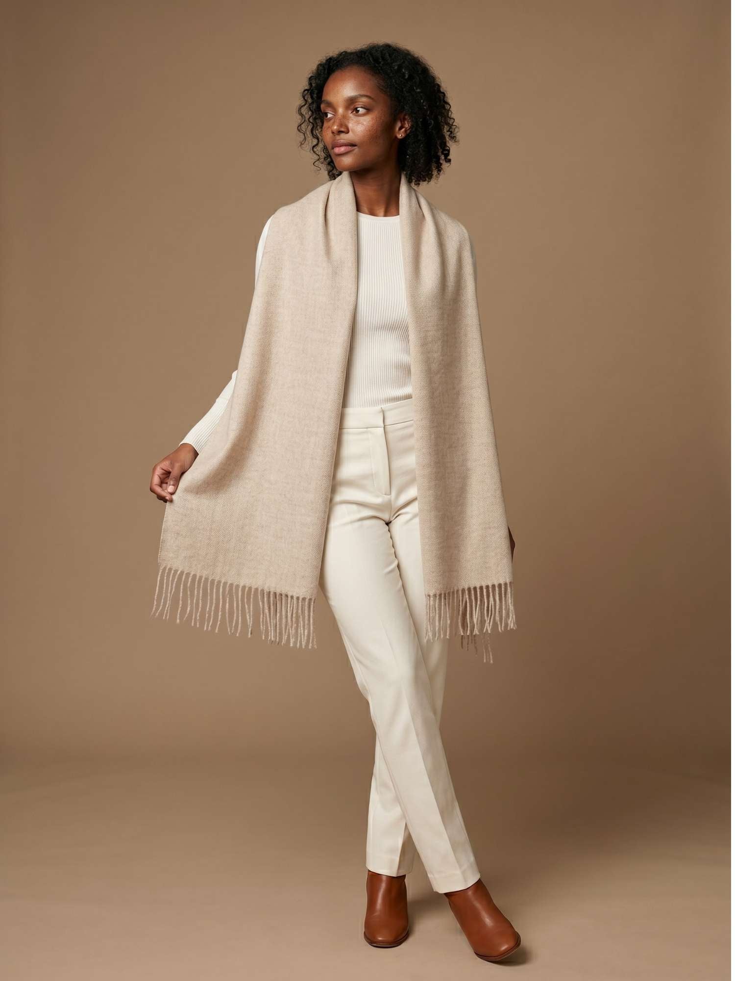 Oatmeal baby alpaca scarf worn over the shoulders — undyed natural fibre tone, handmade in Peru | Orange Inca