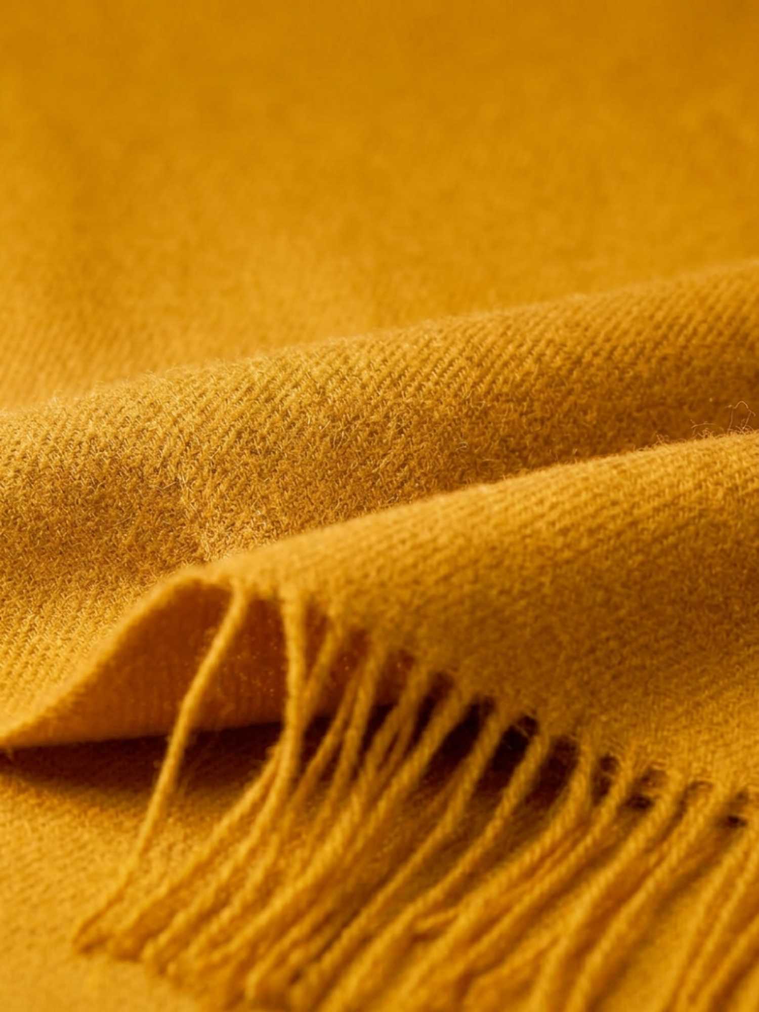 Close-up texture of yellow baby alpaca shawl – ultra-soft natural fibre | Orange Inca