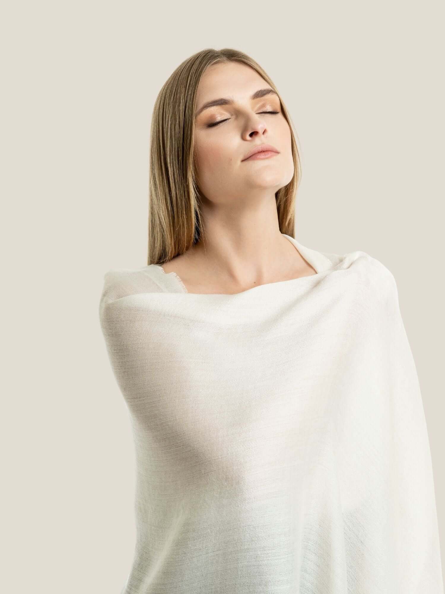 White alpaca wool and silk shawl draped to show full length and drape