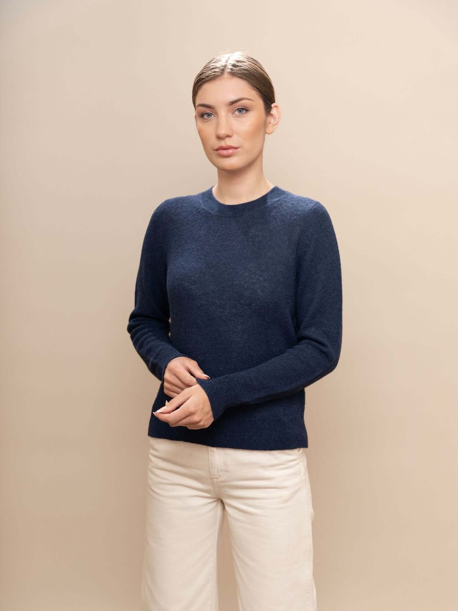 Navy blue sweater showcasing knit detail and tone