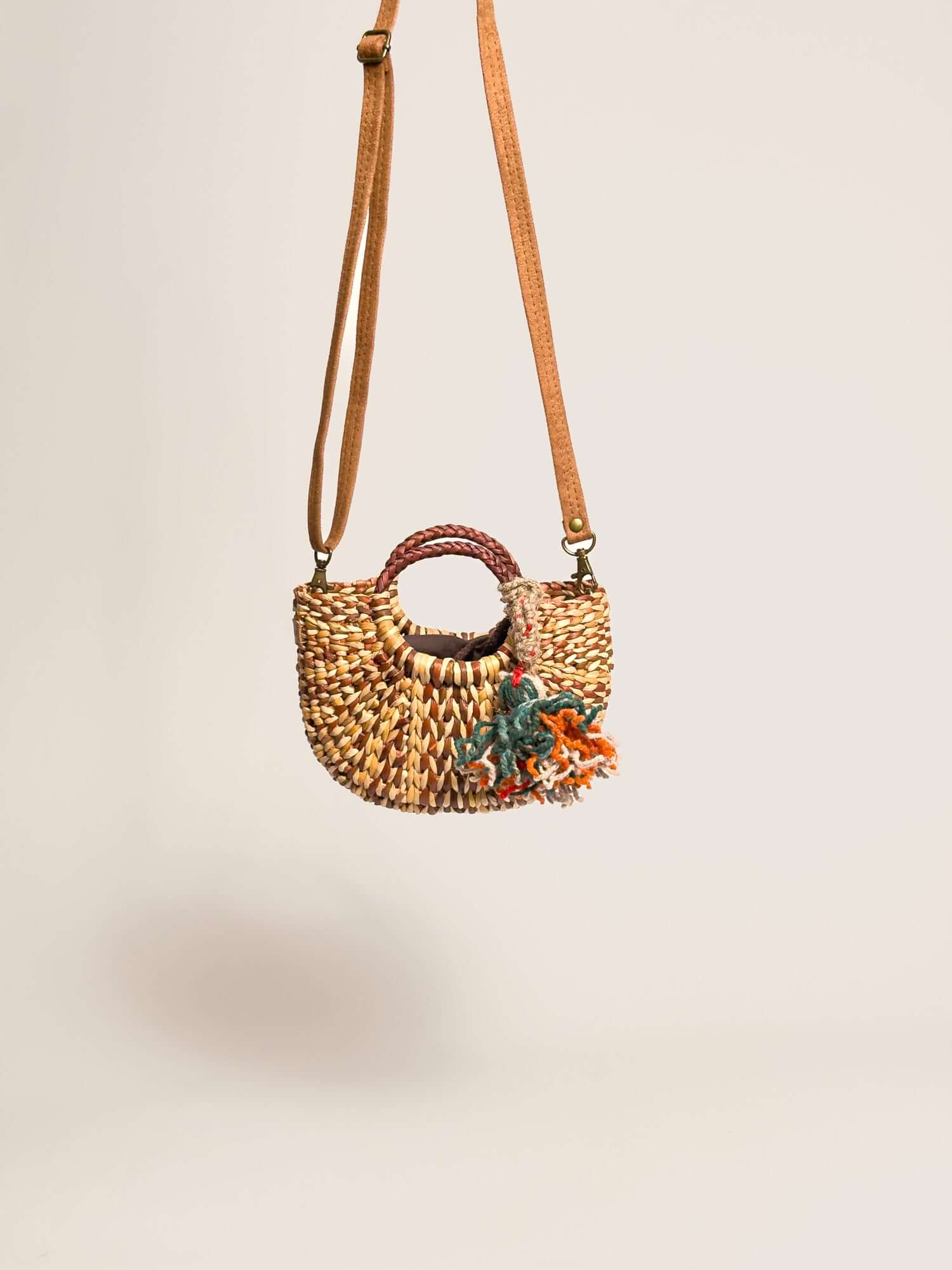 Orange Inca everyday mini bag with artisanal tassel and strap | Marbled Brown