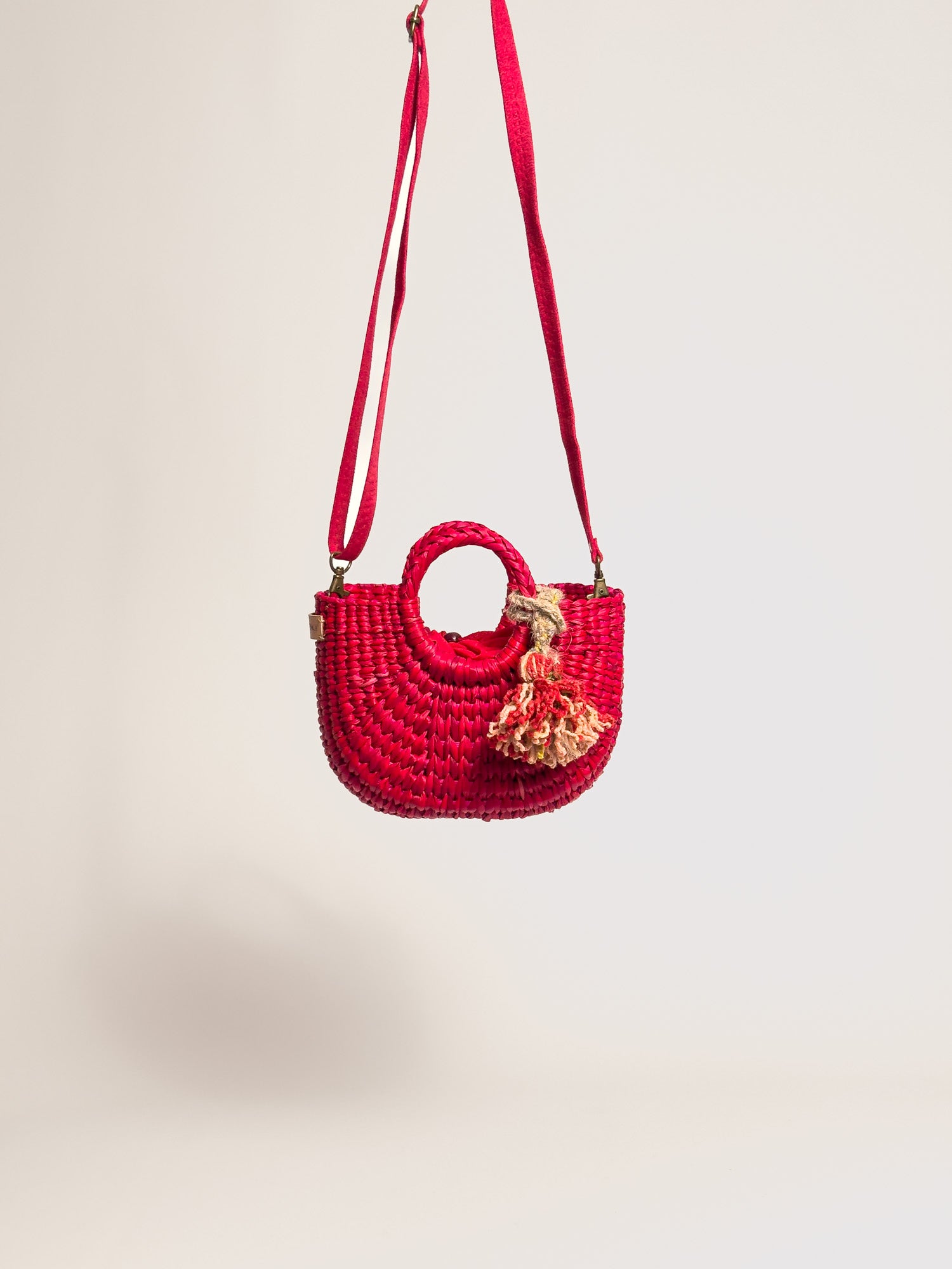 Orange Inca everyday mini bag with artisanal tassel and strap | Red