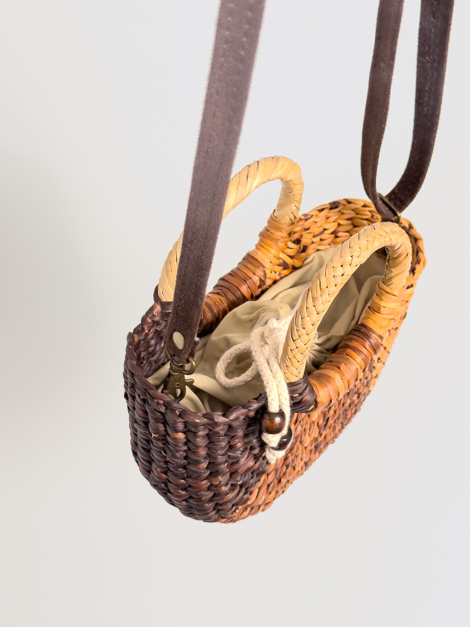 Inside Fiesta Mini reed crossbody bag with drawstring closure |Striped Brown