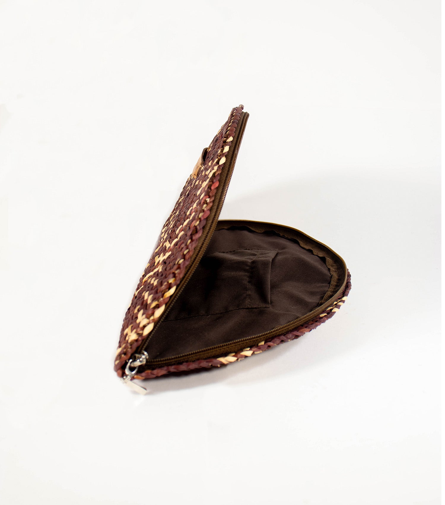 Inside look at Flamenco Clutch, open zipper revealing the elegant lining and convenient inner pocket.