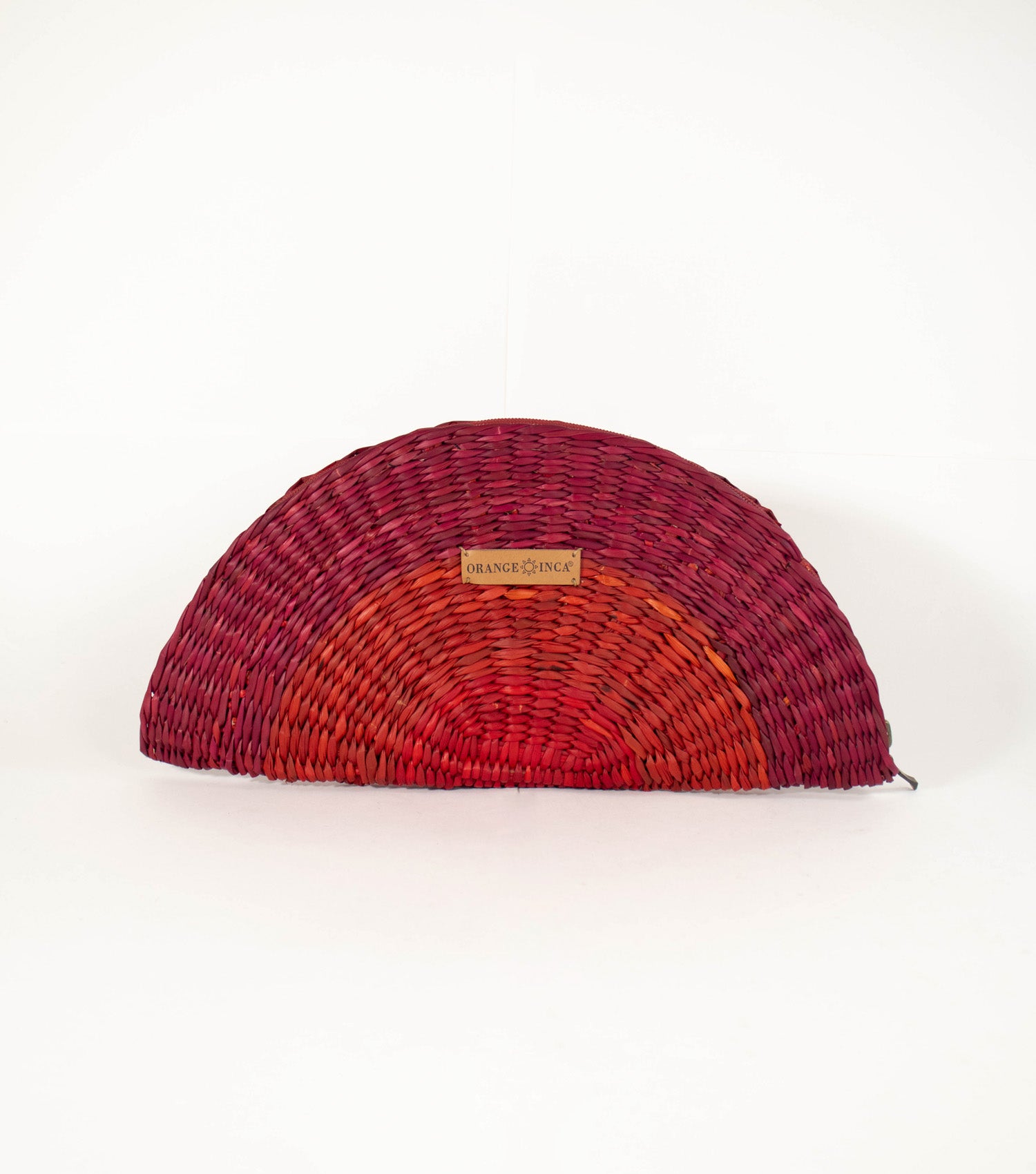 Flamenco Clutch front view - vibrant design with intricate craftsmanship, showcasing Orange and Wine tones, and Orange Inca logo on vegetable leather.