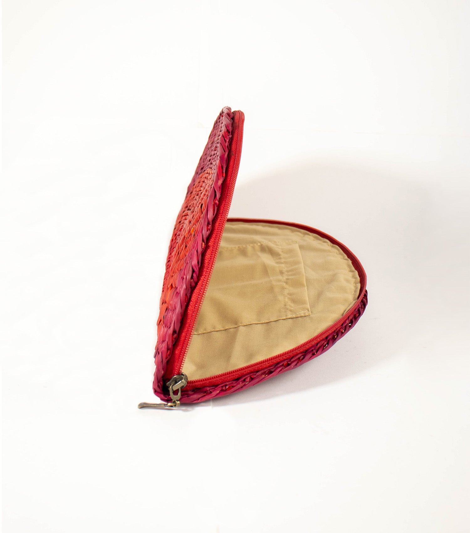 Inside look at Flamenco Clutch, open zipper revealing the elegant lining and convenient inner pocket.