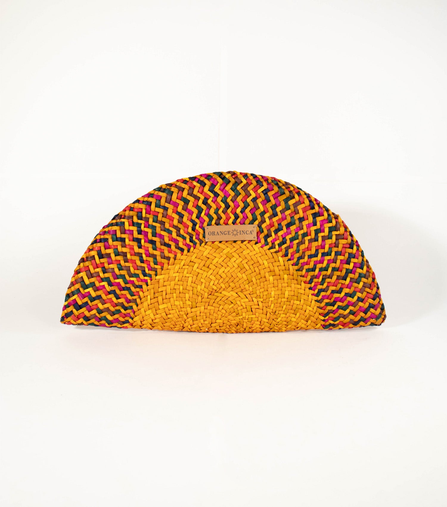 Flamenco Clutch front view - vibrant design with intricate craftsmanship, showcasing Carnival Mustard Yellow tones, and Orange Inca logo on vegetable leather.