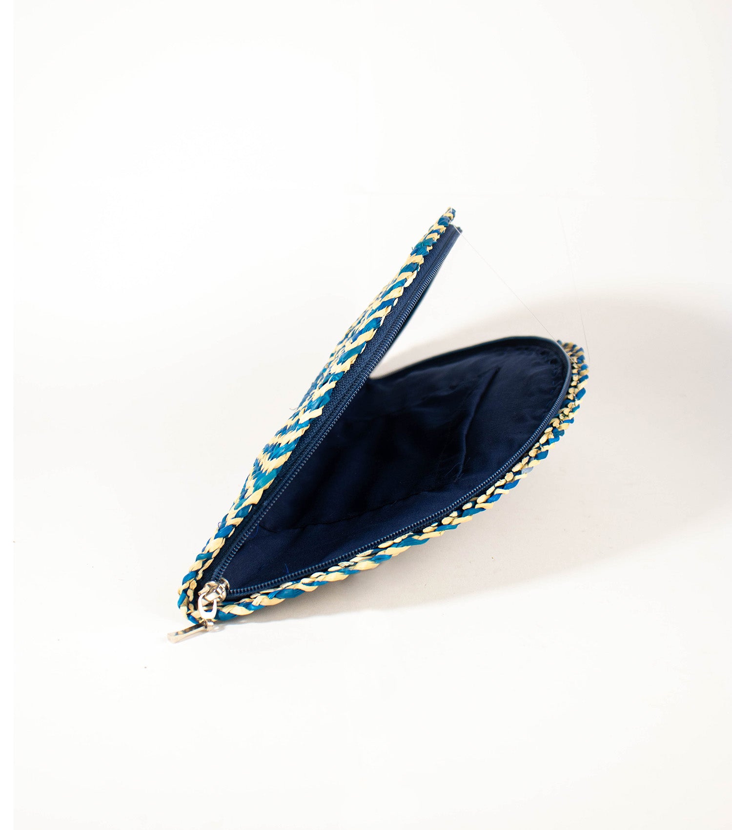 Inside look at Flamenco Clutch, open zipper revealing the elegant lining and convenient inner pocket.