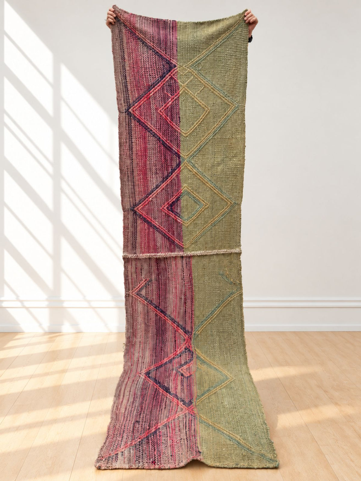 Vintage double frazada runner No. 1 held up in full — dusty pink, plum and sage, handwoven Peruvian sheep and alpaca wool, 290 × 75 cm | Orange Inca