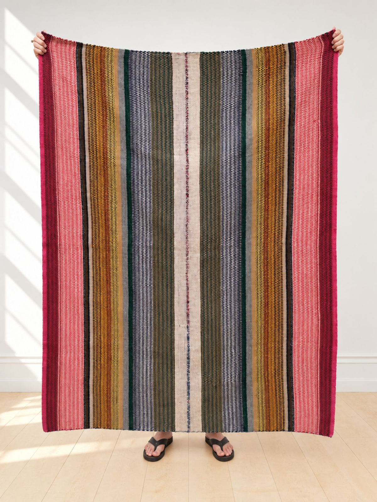 Vintage frazada rug No. 14 held up in full — candy pink, ochre, olive, slate blue and ivory stripes, handwoven Peruvian sheep and alpaca wool, 196 × 143 cm | Orange Inca