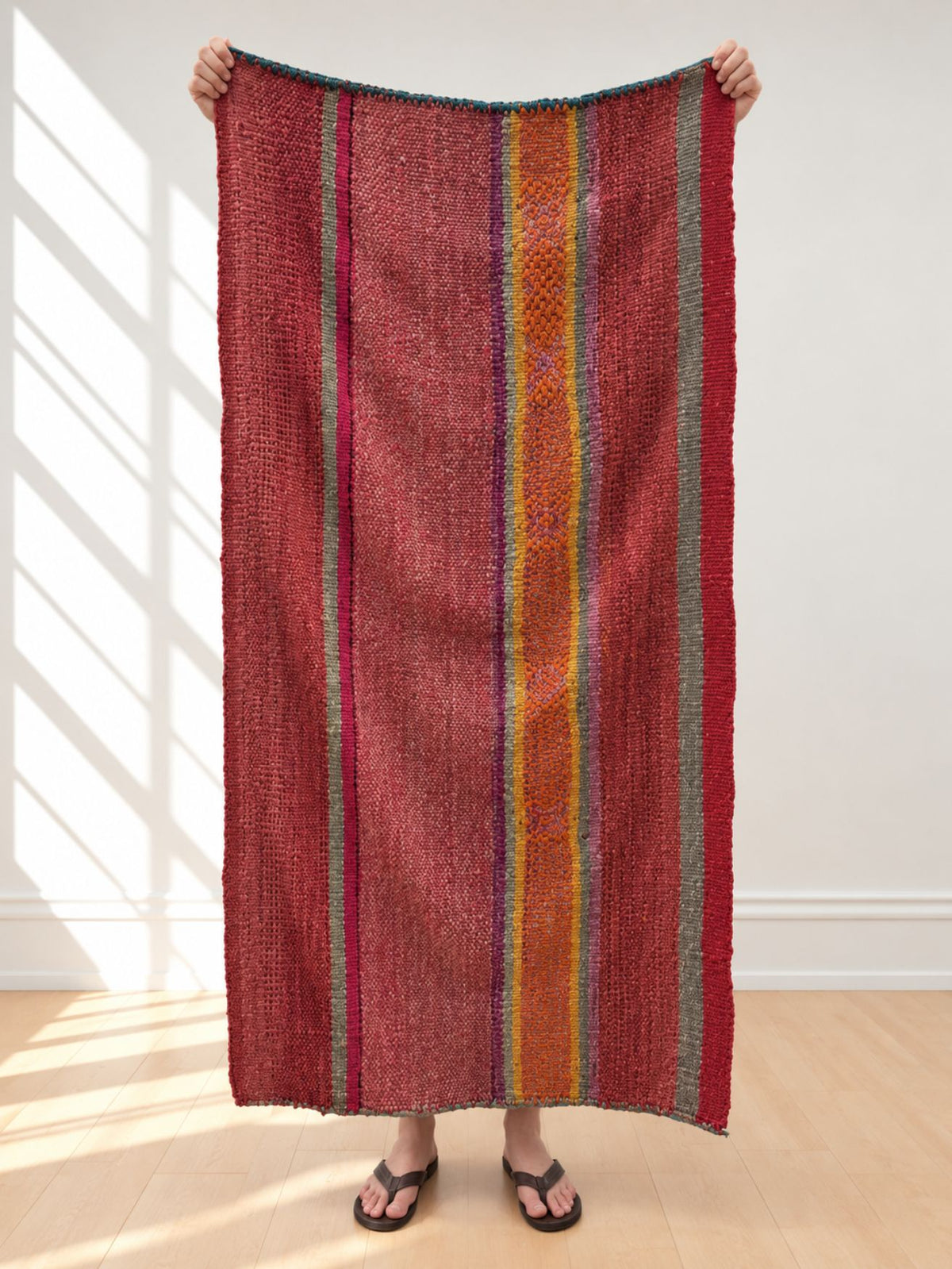 Vintage frazada runner No. 3 held up in full — brick red, burgundy and orange, handwoven Peruvian sheep and alpaca wool, 161 × 87 cm | Orange Inca