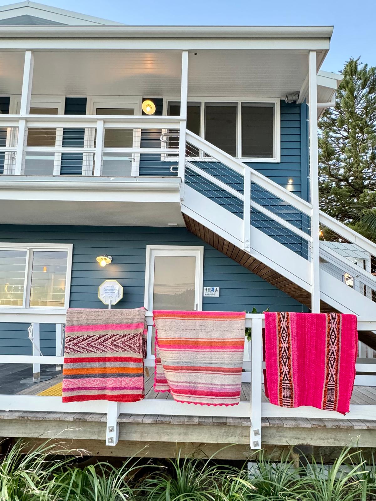 Peruvian Frazada Rugs and Blankets hanging over the deck of a beautiful Hamptons setting in the Northern Beaches of Sydney