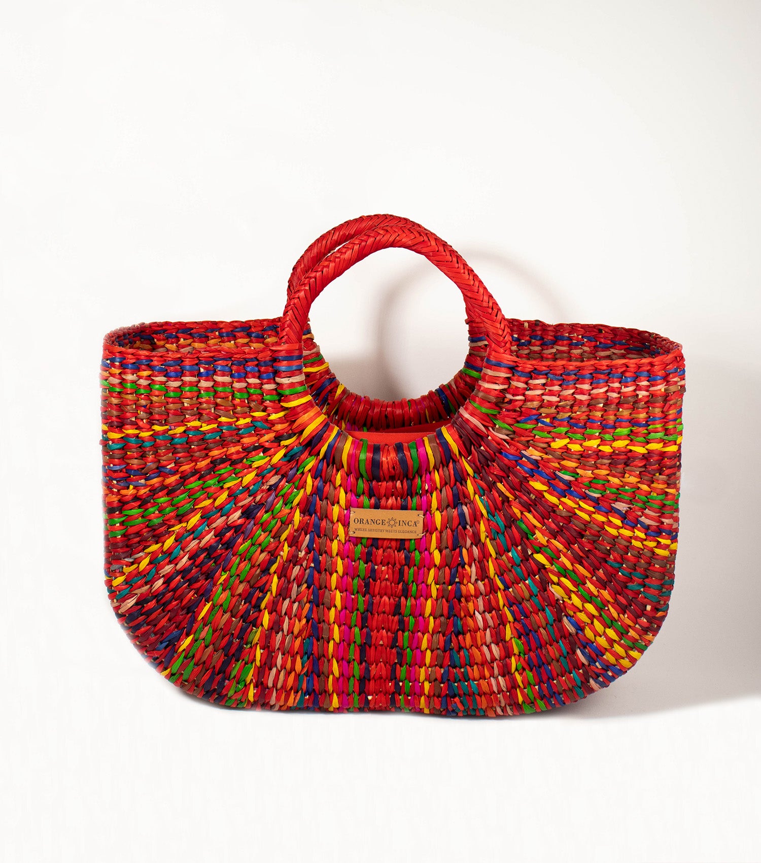 Gran Fiesta Tote front view - Red Carnival junco weave showcases the tote's expansive and elegant design, embodying Orange Inca's commitment to artisanal beauty.