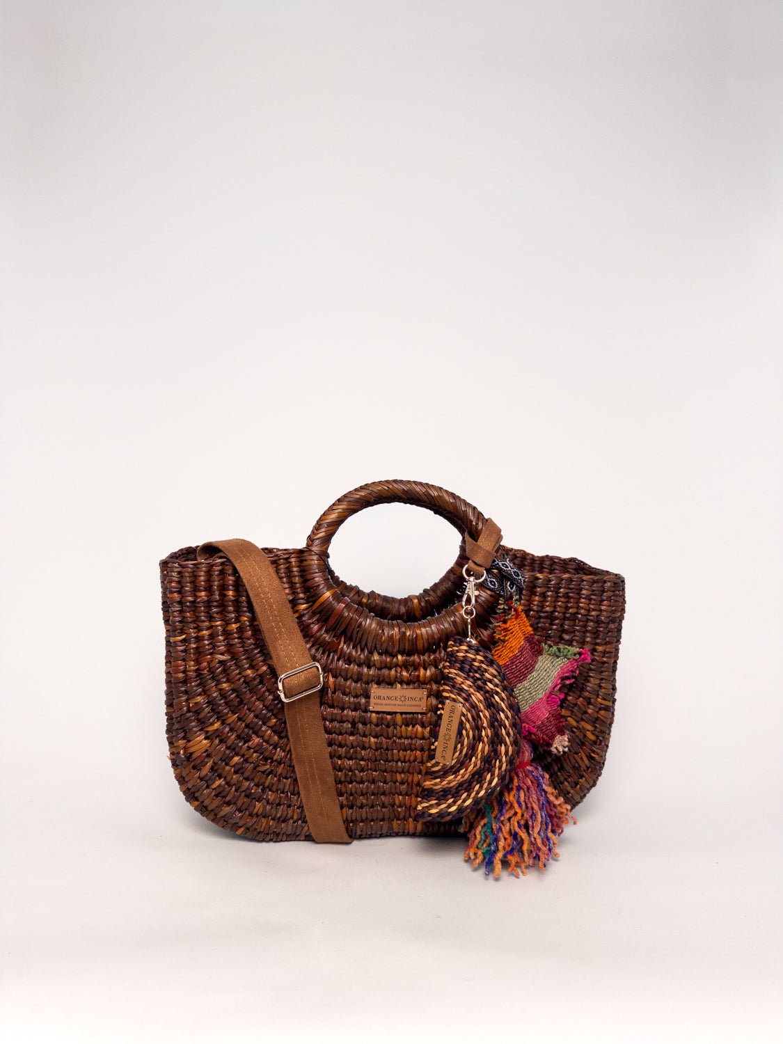Gran Fiesta Crossbody Tote - Brown, handwoven junco tote bag with structured handles and adjustable strap.