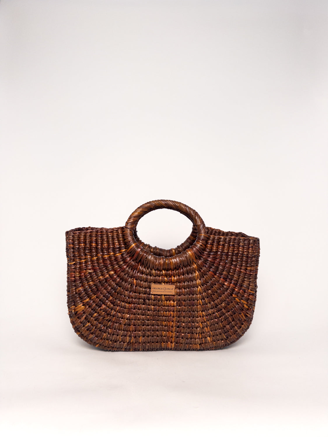 Gran Fiesta Crossbody Tote - Brown, handwoven junco tote bag, structured handbag, handles visible.