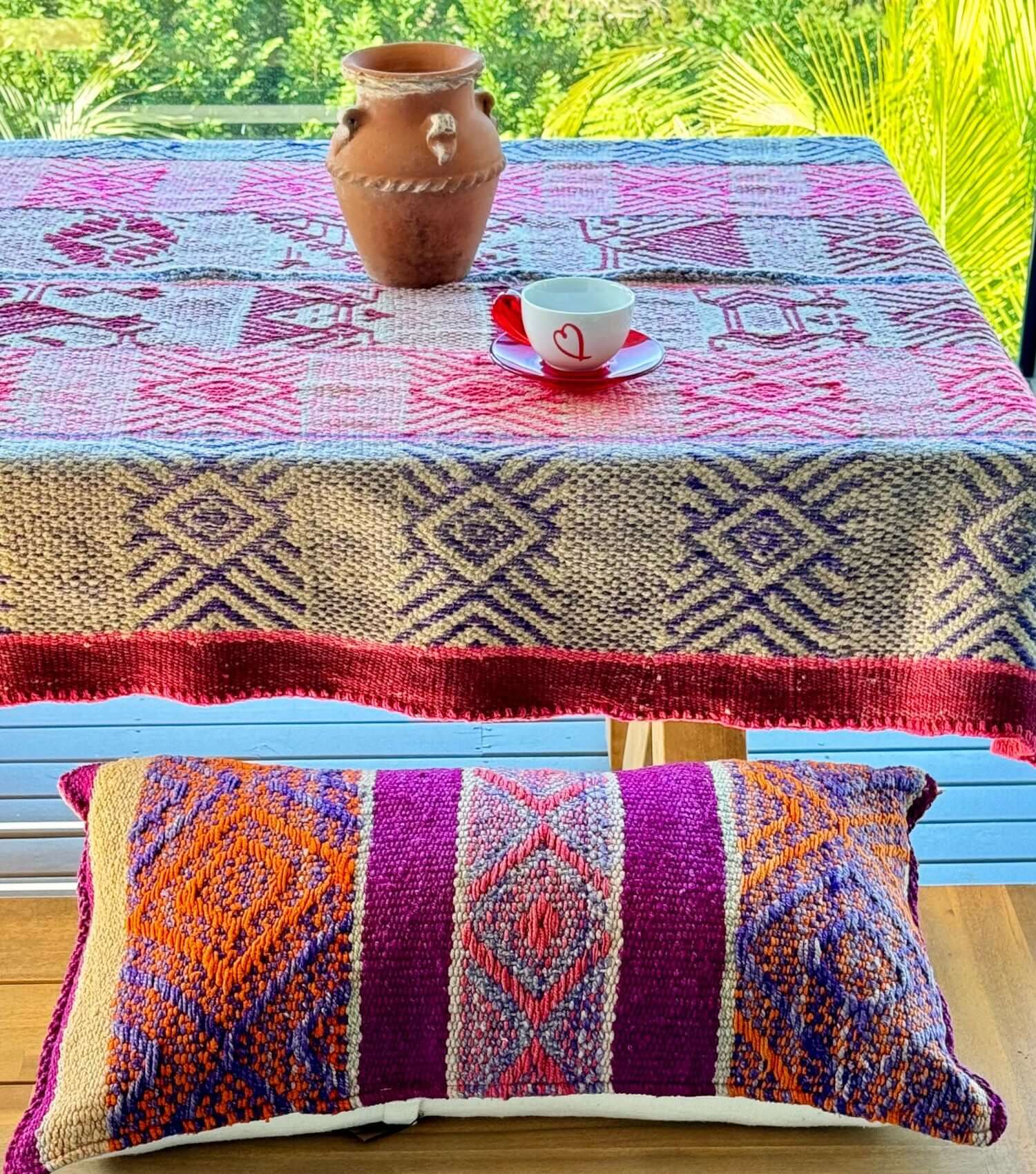 Peruvian frazada No. 13 styled as outdoor table cloth — washed blue and pink, handwoven in Peru | Orange Inca